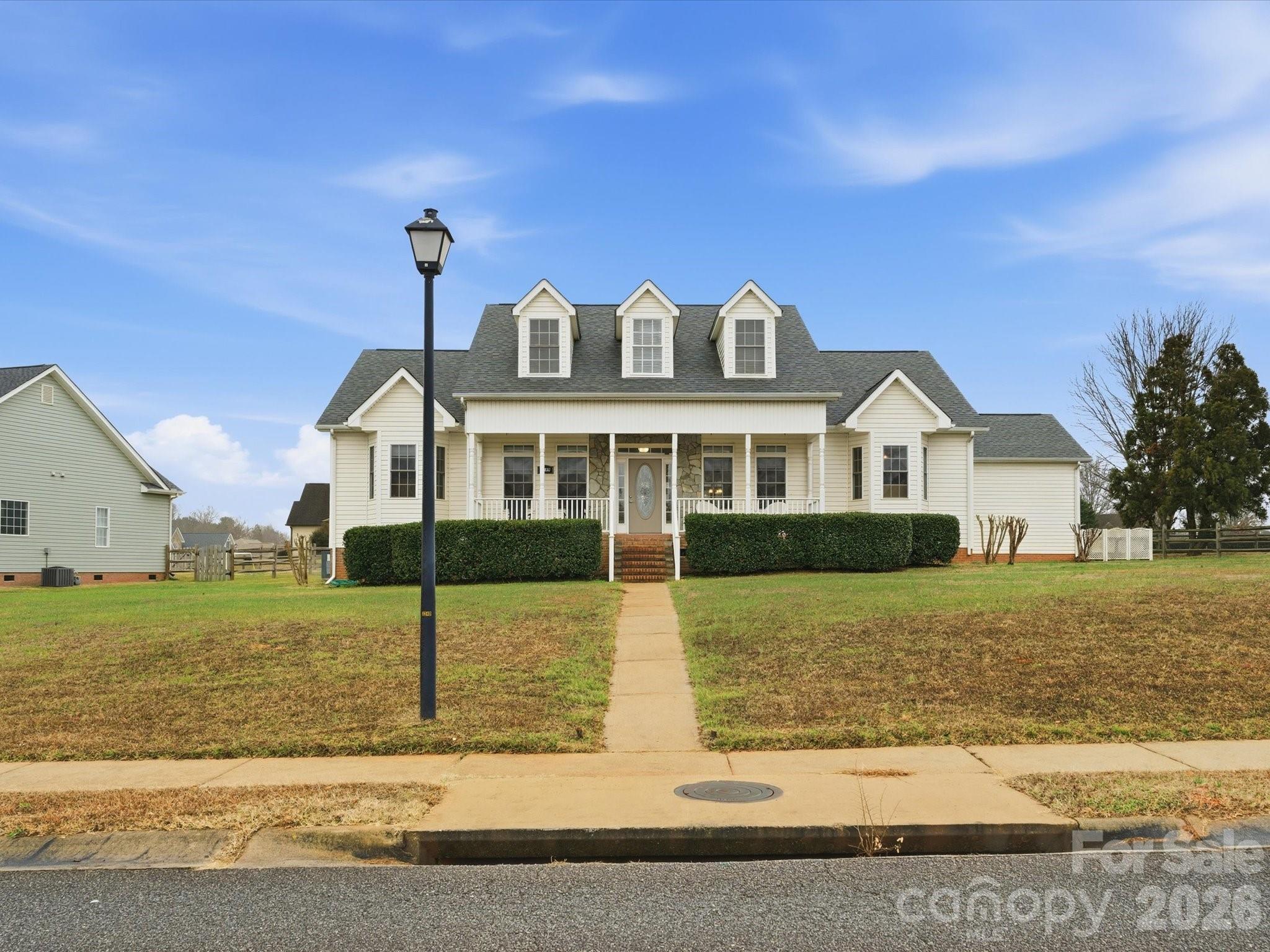 Beautiful one-level living on a level lot with few steps down to the backyard, offering comfort, accessibility, and long-term value. An expansive front porch welcomes you home—perfect for morning coffee, evening conversations, or simply enjoying the neighborhood—setting the tone for the thoughtful design found throughout.

A gracious foyer opens to a well-appointed layout featuring a formal dining room and a private office or flex space, ideal for working from home or quiet retreat space. This home offers a highly desirable split floor plan, providing privacy between the primary suite and secondary bedrooms—ideal for both everyday living and hosting guests.

The primary en suite is a true retreat with double vanities, a separate shower, and a relaxing garden tub. At the heart of the home, the open-concept kitchen features a large center island and flows seamlessly into the main living areas, creating a perfect space for entertaining and gathering. All living areas are conveniently located on one level.

An attached two-car garage accessed from the rear street enhances curb appeal and functionality with very few steps to get inside.

Adding exceptional future value, the home offers over 1,000 square feet of walk-up attic space ready for expansion. This area is already equipped with some electrical and plumbing, making it easy to create additional living space such as a bonus room, guest suite, or home office. 

A rare opportunity to enjoy true one-level living today with the flexibility to grow tomorrow.
