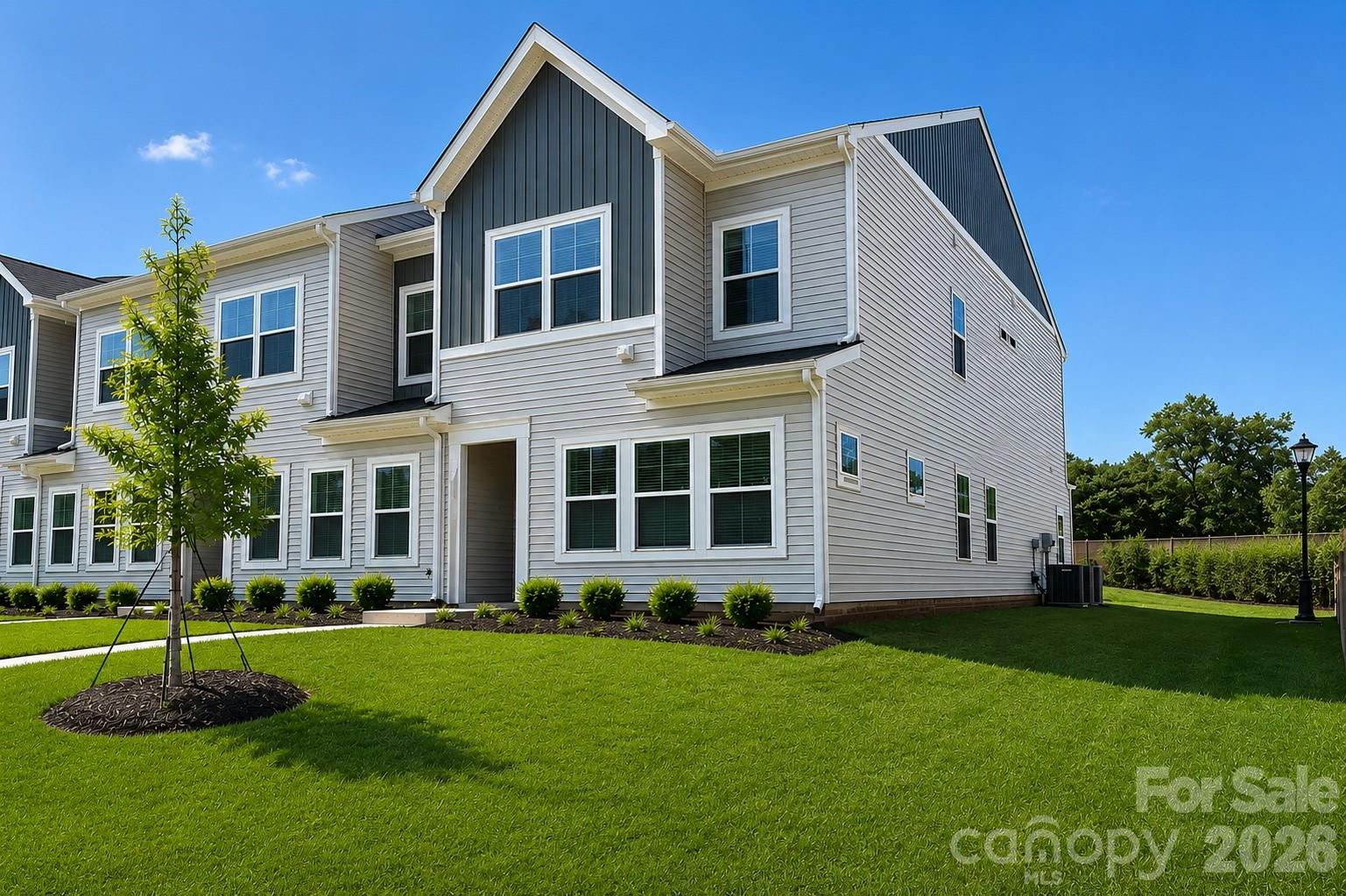 Award-winning craftsmanship meets thoughtful design in this stunning new construction end unit townhome by Mungo Homes. Built with today's lifestyle in mind, this home features soaring 9-foot ceilings, an open-concept layout, and beautifully curated finishes throughout. The kitchen is designed to impress with quartz countertops, soft-close cabinetry, stainless steel GE appliances, and a spacious island ideal for entertaining. A convenient mudroom and ample storage throughout the home provide exceptional functionality. Upstairs, the spacious primary suite features a tray ceiling, oversized walk-in closet, and spa-inspired bath with quartz countertops and a beautifully tiled walk-in shower. Enjoy the convenience of exterior maintenance, community sidewalks, and a neighborhood dog park, all just minutes from Uptown Charlotte, Riverbend Village, Northlake Mall, Charlotte Douglas International Airport, I-77, and I-485. Ask about our available incentives and builder move in specials.