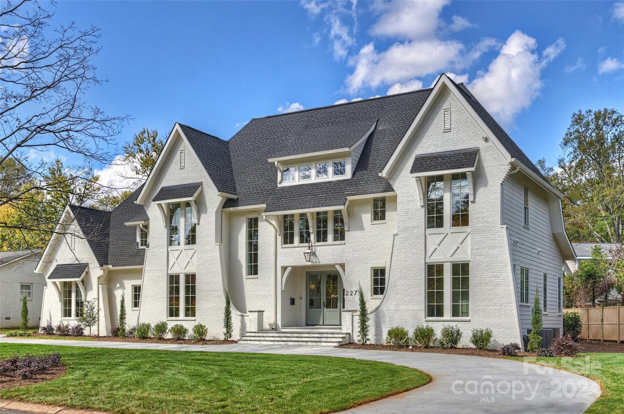 Discover timeless elegance in this exquisite new construction home by Joyce Building Co! 6 bedrooms/5 full baths on a sprawling .45-acre lot. Impeccable curb appeal w/ painted brick exterior, gas lantern, & pristine landscaping. Beautiful white oak flooring & designer fixtures/finishes throughout! The desirable open floorplan is filled with natural light, leading to a gourmet kitchen w/ quartz countertops, high-end stainless appliances, abundant custom cabinetry & walk-in pantry. Kitchen opens to the sunny dining room and great room w/ cast stone fireplace. Luxurious primary suite on the main w/ spa-like bath with zero entry shower, soaking tub & generous walk-in closets. Guest suite & office/flex also on main! Upstairs find a cozy loft PLUS huge bonus room & 4 secondary bedrooms (3 with en-suite baths). Add’l media room on 3rd level! Seamless indoor-outdoor living on the covered porch w/ outdoor fireplace. Experience unparalleled craftsmanship & modern comfort in this stunning home!