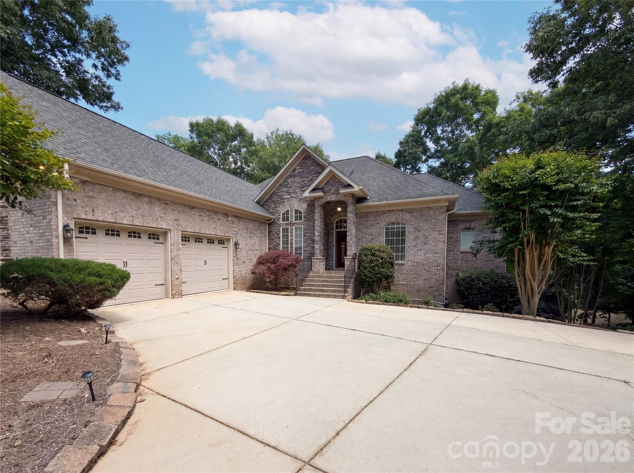 Welcome to this stunning custom-built home nestled in the desirable Catawba Crest community! Situated on a private waterfront lot with beautiful Lake Wylie views, this home offers the perfect blend of luxury, comfort, and entertaining space. Featuring spacious living areas, a gourmet kitchen with custom cabinetry and stainless-steel appliances, hardwood floors, vaulted ceilings, and a beautifully finished basement with second living quarters and full kitchen. Enjoy outdoor living with expansive decks, patio space, and private dock access. Conveniently located near shopping, dining, and award-winning Clover schools. A rare opportunity to enjoy lake living at its finest!