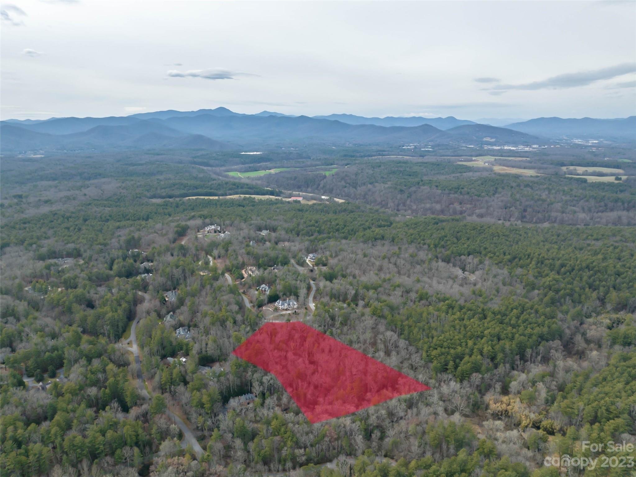 Introducing a rare opportunity in the heart of Biltmore Forest - a secluded and private 3.96-acre parcel of land boasting 380 feet of tranquil creek frontage. This expansive property features multiple build sites with sloping topography, simplifying the construction process and allowing for the creation of the perfect dream home. The potential for sweeping panoramic views adds to the allure, promising a picturesque setting to enjoy daily. The bold running creek along the property's rear boundary provides a soothing natural soundtrack and view.   Embrace the peaceful ambiance and envision the endless possibilities this remarkable parcel holds.