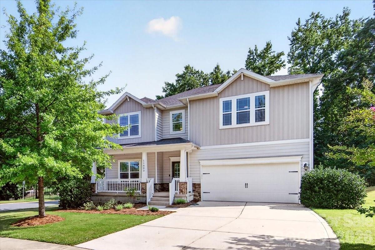 Offering five bedrooms and a versatile floor plan, this home is designed to fit a variety of lifestyles. The open layout creates a comfortable flow for both relaxing and entertaining, while the spacious kitchen features a gas range and center island.

A main-level bedroom provides flexibility for guests, a home office, or multi-generational living. Upstairs, the spacious primary suite features additional room for a sitting area, office space, or whatever best suits your needs. The ensuite bath includes dual vanities, a separate tub and shower, and a divided walk-in closet designed for everyday convenience.

Outside, you'll appreciate the wooded backyard, deck, and welcoming front porch, offering great spaces to relax or enjoy time with family and friends. Neighborhood amenities include a community pool & playground with reasonable HOA dues, and the location offers easy access to Concord Mills, UNC Charlotte, shopping, dining, movie theater, & major commuter routes. Come see all this home has to offer!