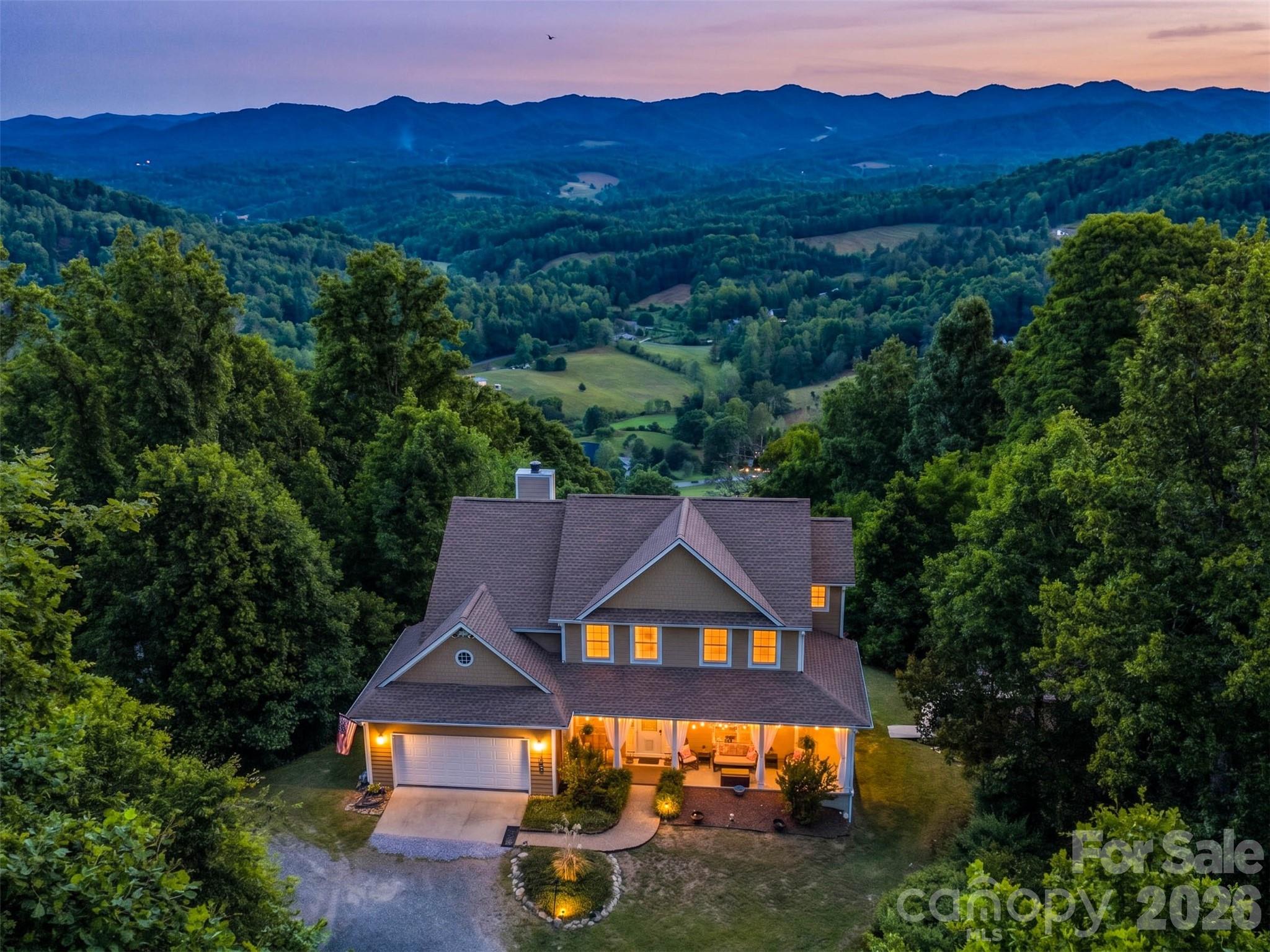 This property offers the luxury mountain lifestyle buyers dream about. Located in coveted Seven Glens, this home delivers the kind of long-range Blue Ridge Mountain views that truly stop you in your tracks. Whether you're enjoying quiet mornings or hosting guests this thoughtfully updated home is designed for both comfort and entertaining.

Inside, you’ll find inviting living spaces filled with natural light and Brazilian cherry hardwood flooring. A finished lower level features radiant floor heating, expansive family room and a private lounge perfect for unforgettable evenings with family and friends. It also offers flexibility with a bonus room and full bath, creating the potential for a private guest suite or multi-generational living space.

Recent updates include a new roof, fresh exterior paint, granite countertops and Trex composite decking designed to maximize outdoor living while taking in the breathtaking mountain scenery that surrounds the home.

Located just outside of downtown Weaverville and a short drive to Asheville, this exceptional home offers the perfect balance of privacy, luxury, and convenience.