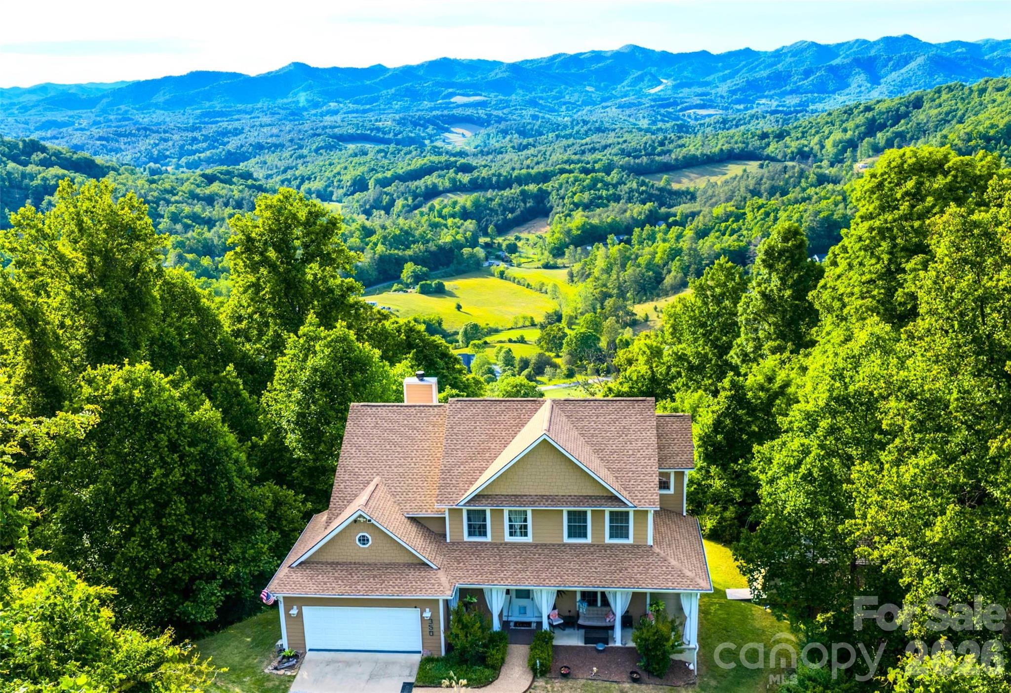 This property offers the luxury mountain lifestyle buyers dream about. This home delivers long-range Blue Ridge Mountain views that truly stop you in your tracks. Whether you're enjoying quiet mornings or hosting guests, this thoughtfully updated home is designed for both comfort and entertaining.

Inside, you’ll find inviting living spaces filled with natural light and Brazilian cherry hardwood flooring. A finished lower level features radiant floor heating, expansive family room and a private lounge perfect for unforgettable evenings with family and friends. Lounge can easily convert to kitchen and dining area, with a bonus room and full bath, creating the flexibility to offer potential for a private guest suite or multi-generational living space.

Recent updates include a new roof, fresh exterior paint, granite countertops and Trex composite decking designed to maximize outdoor living while taking in the breathtaking mountain scenery that surrounds the home.

Located just outside of downtown Weaverville and a short drive to Asheville, this exceptional home offers the perfect balance of privacy, luxury, and convenience. Only a few short minutes to grocery, dining and convenience stores. To make your transition into this mountain retreat even more seamless; furnishing are negotiable, home warranty provided and buyer bonus if closed by August 9th.