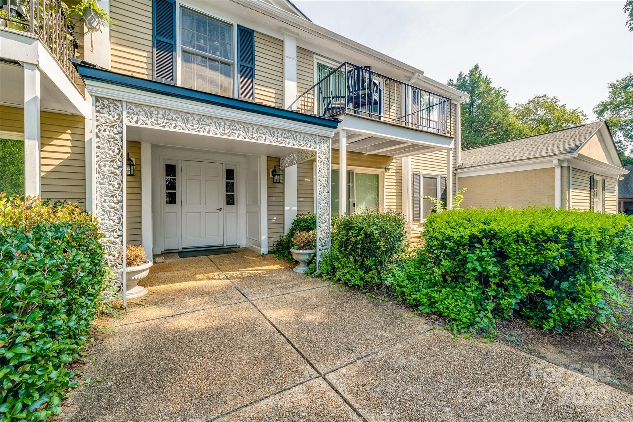 The time is now! SELLER TO PAY ONE FULL YEAR OF MONTHLY HOA DUES AT CLOSING!!  The location is amazing, but with a recent paint job, it is better than ever!  After you walk through the charming entry of the building, a small foyer welcomes you into this cozy condo on the main floor and back side of the building.  Built-in shelving and cabinets grace the walls on both sides of the fireplace and the den opens up to a screened porch that is nestled in a backyard area with a private feel. The HVAC was replaced in 2023 and a walk-in shower was installed in the primary bathroom.   Also, of note, the kitchen appliances - all included with the property - were new in 2022 and the kitchen sits opposite of the spacious dining area.  HOA dues include gas, water/sewer, trash, landscaping, exterior maintenance and carport, 2 pools, tennis courts, clubhouse, lakes and walking trails.  There is one detached assigned carport space with storage that comes with the condo and additional parking available.
