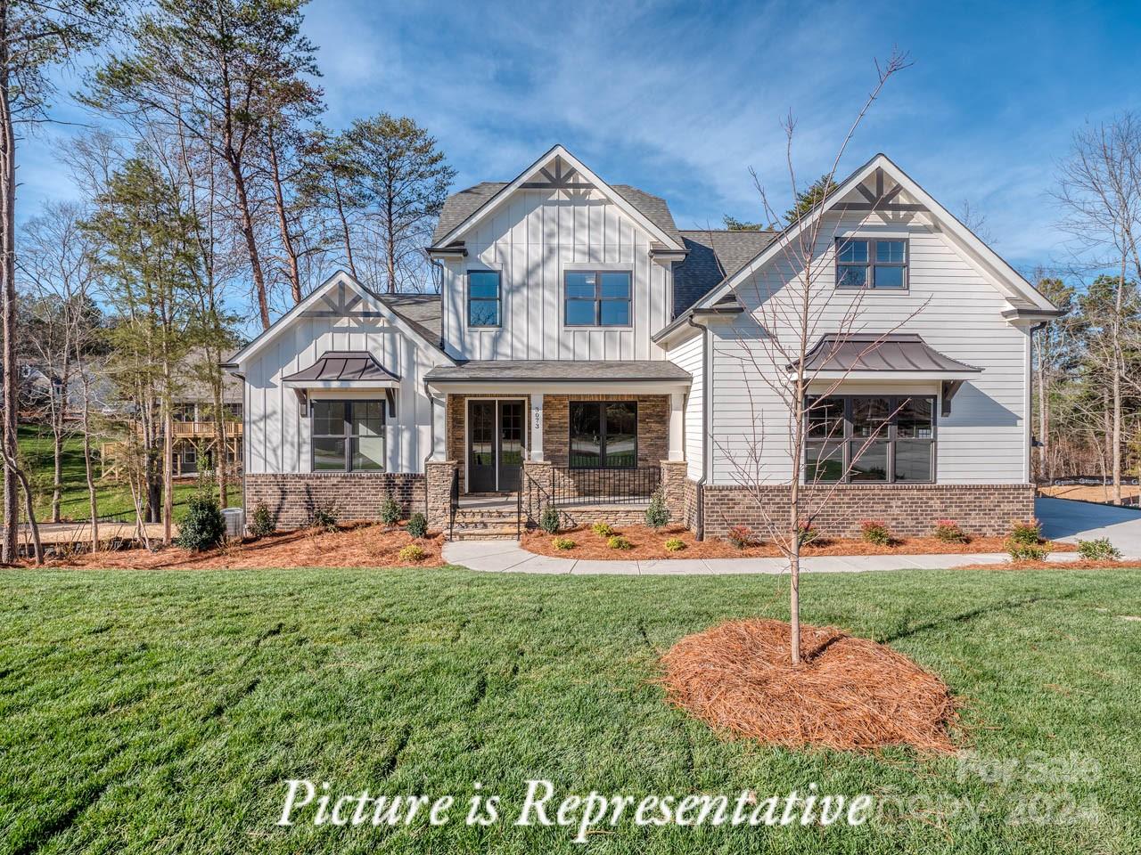 Beautiful new construction in the lake front community, Handsmill on Lake Wylie. This 6 bedroom, 5.2 bath home features .55ac on a private cul de sac. 1st Fl has a spectacular open kitchen, great room with fireplace, mud room with drop zone leading to laundry rm and 3-car garage, great covered deck with fireplace, office/flex space and a primary bedroom with large bath and custom closet. 2nd Fl features 3 bedrooms 2 baths and a large bonus room with plenty of storage.  Basement is perfect for multi-generational living with full kitchen, dining, media/workout rm, great room, second primary bedroom with large closet and bath, and a secondary bedroom with bath.  Home includes structured wiring for networking, speakers and security.  Handsmill is one of Lake Wylie's premier custom communities, featuring a quiet atmosphere, a community pool with clubhouse, walking trails and just minutes from top rated Clover schools, restaurants, and shopping.
