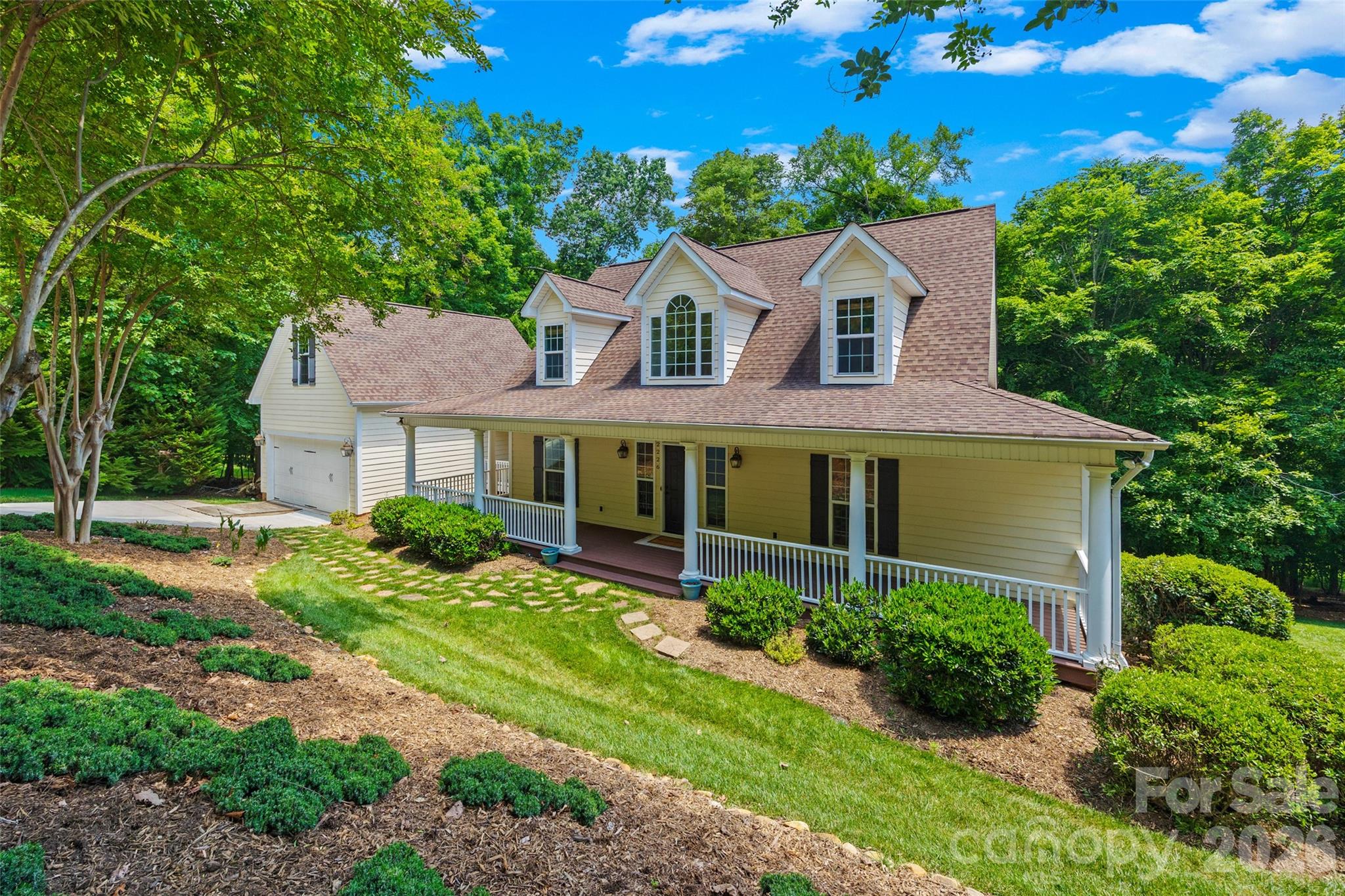 Listed below appraised value, this custom waterfront home is situated on over 3 acres of serenity with no HOA! Enjoy your morning coffee on the screen porch, overlooking a wooded and water view, with lake access for kayaking, fishing, or other paddle launch activities on Lake Wylie. Or unwind on the lower paver patio beside the large fenced in yard, and additional area that has been leveled for recreation. At the start of the driveway is an out-of-this-world workshop, with garage style entrance for equipment and all of the amenities you could want (see attachment for equipment selling separately). As you enter from the welcoming wrap-around front porch, you are greeted by a 2-story foyer and gleaming hardwoods. An open concept floor plan maximizes views and gives tons of natural light. The great room is centered by a stacked stone wood-burning fireplace and built-ins. The chef's kitchen gives a warm ambiance, with a wood cooking hood, center island, stainless-steel appliances, ample counter space, as well as a breakfast area and adjacent formal dining room. The primary suite on main has additional access to the rear deck, as well as an expansive walk-in closet, bathroom with walk-in spa-like shower, double sinks, and more. Rounding out the downstairs is a half bath, laundry room, and loads of storage. Upstairs you'll find 2 generous bedrooms, a full bathroom, and a sizable bonus room. Over the garage is a walk-up to another flex/office/movie room/exercise/bonus/loft space, giving you tons of flexibility and options. With too many features to mention, including new carpet, in-ground irrigation, an oversized garage with extra store space, and more. This home is of the best kept secrets with award-winning Fort Mill Schools, convenient to Rivergate shopping, easy access to Charlotte Douglas International Airport and I-77 and I-485, all tucked away in a private retreat surrounded by nature - Welcome Home!
