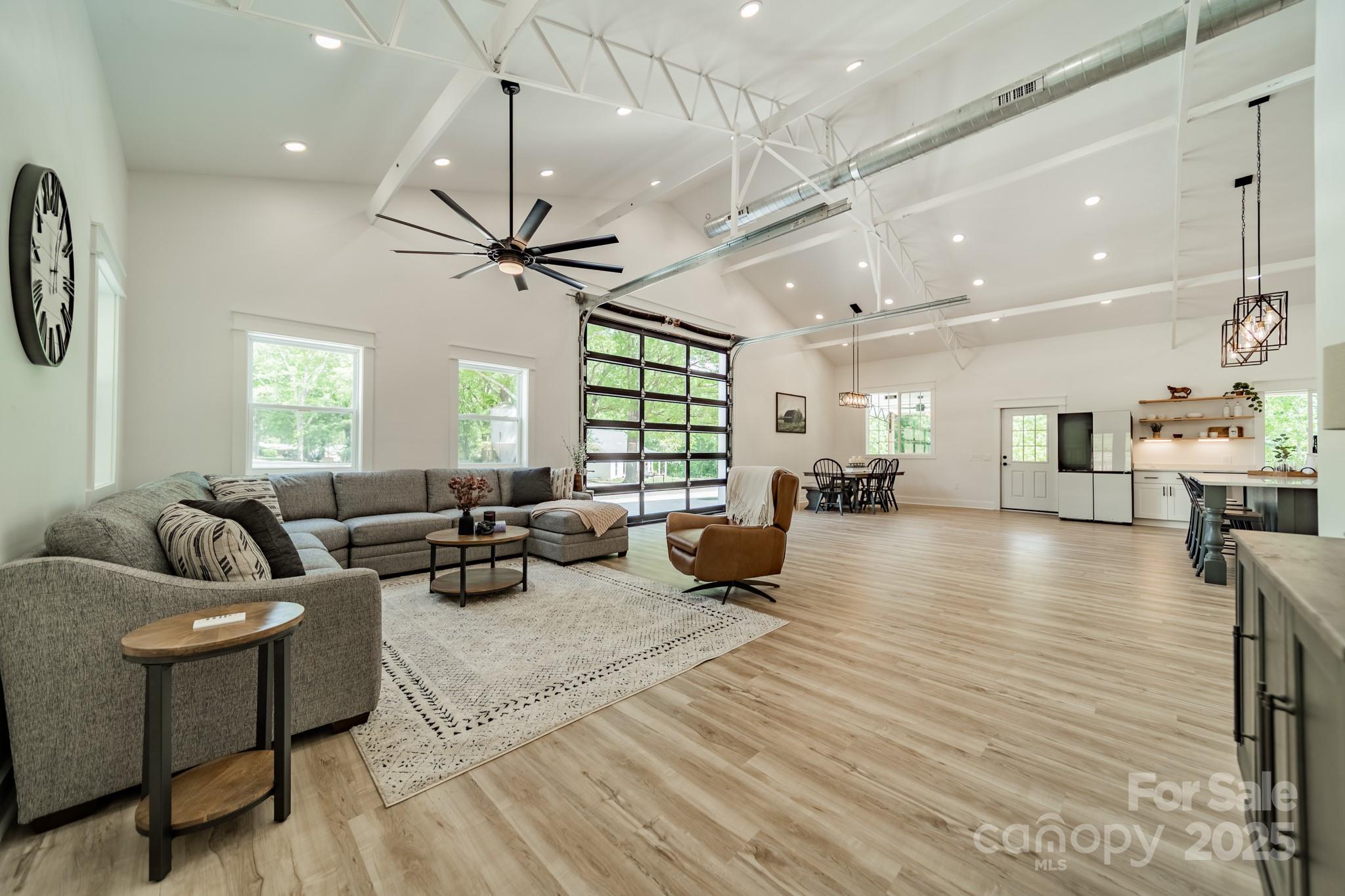 Rare 7-Acre Estate in Fort Mill. A one-of-a-kind opportunity just minutes from Charlotte - this 7-acre estate blends modern luxury, eco-friendly systems, and timeless Southern charm. The 3,200+ sq. ft. residence features 5 bedrooms, 2.5 baths, vaulted ceilings, and premium finishes throughout. The chef's kitchen is built for entertaining with a professional-grade gas stove, oversized island seating six, touchless faucet, and a pass-through window to a covered grilling porch with natural gas hookups. An oversized pantry offers water connections, room for a second fridge, or coffee stations. Energy-efficient features include spray foam insulation and a gas-powered tankless water heater. Outdoors, enjoy rolling hills, patios, and space for recreation or horses in a private, mature neighborhood, all within easy reach of Fort Mill, Rock Hill, Indian Land, Baxter Village, Tega Cay, Pineville, Ballantyne, and Charlotte.