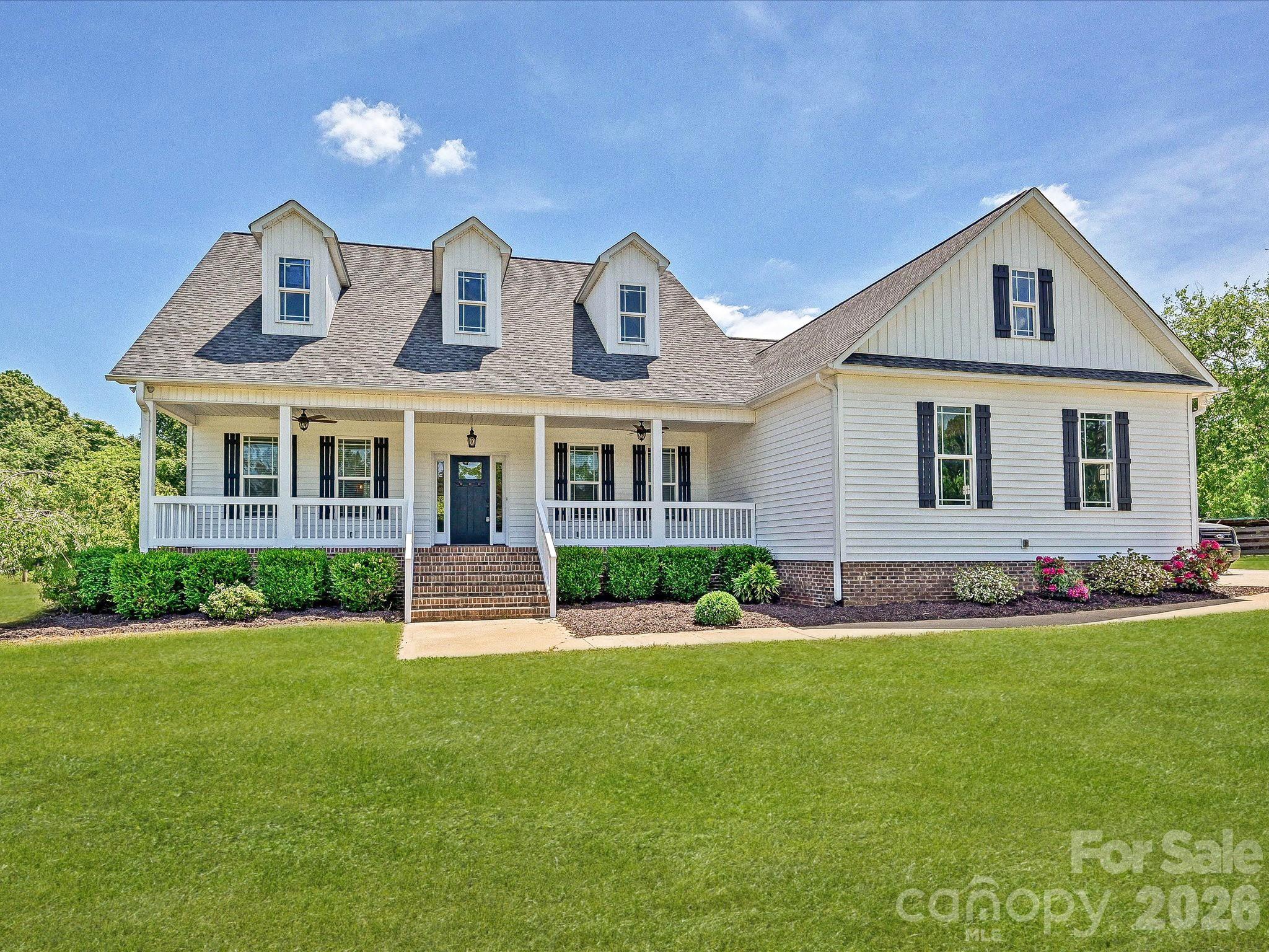 A rare opportunity to own 5 private, fully usable acres with true functionality and efficiency—ideal for buyers seeking space without sacrificing modern convenience. This well-maintained 4-bedroom, 3-bath home, built in 2017, offers a thoughtful blend of open living, modern systems, and flexible outdoor space.

A long driveway sets the home back for privacy, opening to expansive, fenced grounds that create a clean, estate-like setting with room to grow, play, or expand.

Inside, the open-concept layout features hardwood floors, abundant natural light, and vaulted ceilings across the main living areas. The kitchen is both functional and inviting with granite countertops, a double sink, GE Profile appliances, and a generous breakfast bar that flows seamlessly into the dining and living spaces.

The main level includes comfortable living areas and a dedicated laundry room with washer and dryer. Upstairs, a versatile bonus room with full bath and closet serves perfectly as a fourth bedroom, guest suite, or private office.

This property stands out with its combination of efficiency and infrastructure, including solar panels for long-term energy savings, fiber optic internet, central vacuum, and an EV charging hookup in the garage—a rare mix for acreage properties.

The detached garage/workshop adds valuable flexibility for storage, hobbies, or equipment, while the open land provides space for a future pool, additional structures, or simply enjoying the privacy and scale.

Relax on the covered front porch or rear deck overlooking your land—this is country living done right, with the systems and features today’s buyers expect.

Spacious 2 1/2 car garage/workshop,  equipped with 100 amp electric sub panel. 10,000 Lb automotive lift. 
Built in 16 foot workbench. 

2 fenced in pastures. 

Fruit orchard with apple, peaches, pears, fig trees and blueberry bushes.