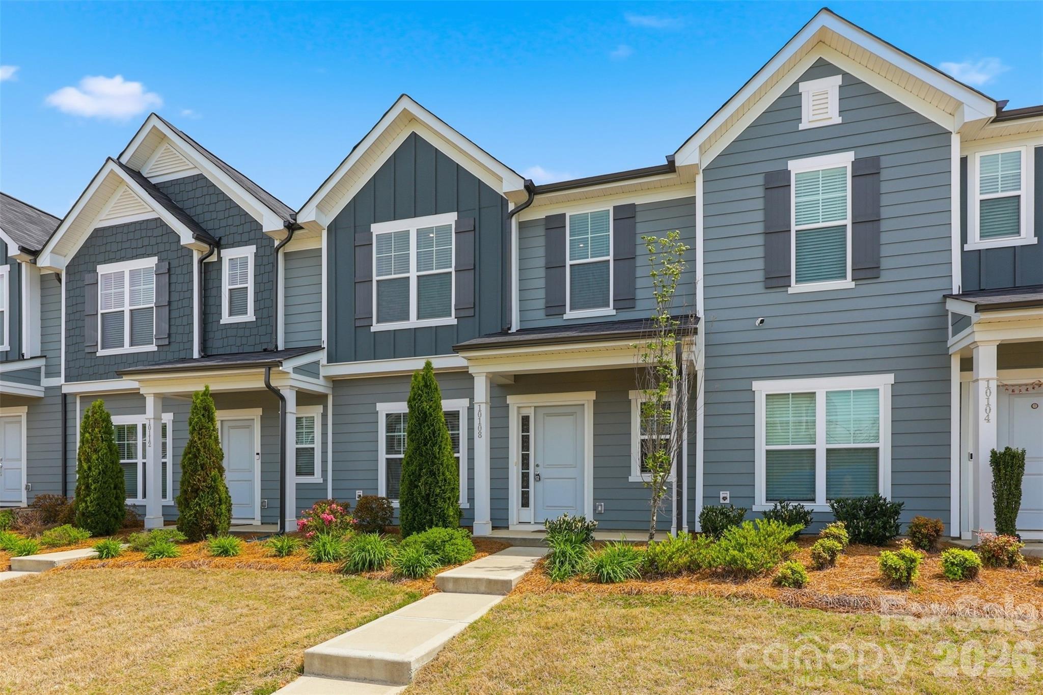 Move-in ready and beautifully appointed, this like-new 3 bedroom/2.5 bath townhome (built in 2023!) is ideally located in the highly desirable Steele Creek area. Inside, you'll find an inviting open-concept main level, where durable and stylish LVP flooring flows seamlessly throughout. The spacious, light-filled living area transitions effortlessly into the dining space and well-equipped kitchen, featuring stainless steel appliances, ample cabinetry and countertop space, and a large pantry, perfect for both everyday living and entertaining. Upstairs, the primary suite offers a true retreat with elegant tray ceilings, a spacious en-suite bath with dual vanities and a large walk-in closet. Two additional generously sized bedrooms share a full bath, while a conveniently located laundry closet completes the upper level. Additional highlights include an attached one-car garage and driveway, providing ample parking and storage. Enjoy unbeatable convenience with close proximity to the Charlotte Premium Outlets, the U.S. National Whitewater Center, CLT Airport, Topgolf, and an abundance of shopping, dining and major highways. Community amenities include a dog park, pool, playground and outdoor areas throughout. The HOA enhances low-maintenance living by covering lawn care, internet, and cable, making this home as effortless as it is exceptional!
