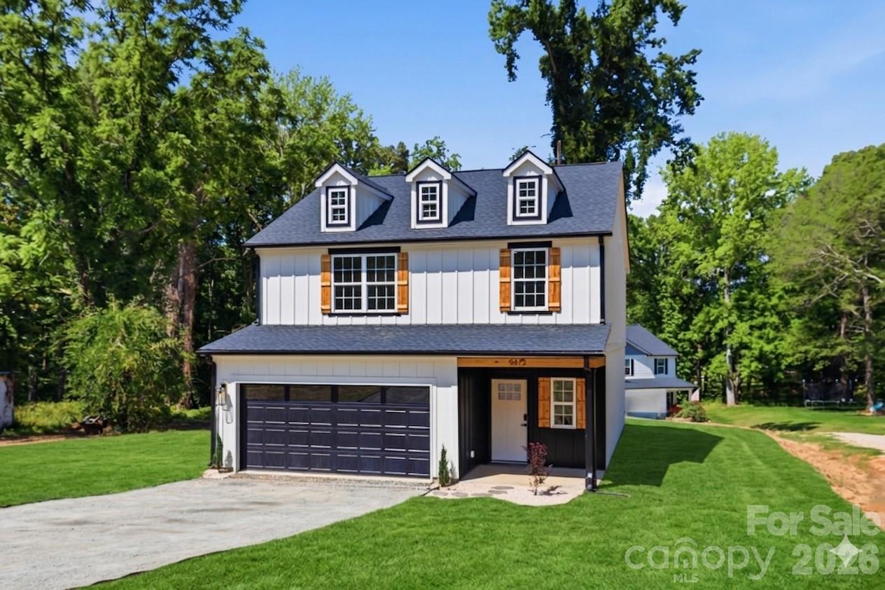 Ready to be impressed? Thoughtfully designed with custom craftsmanship throughout, this newly completed home delivers luxury finishes and elevated details rarely found at this price point.

Step inside to discover beautiful hardwood flooring, an open layout, and a stunning kitchen designed to be the heart of the home. Featuring granite countertops, a dramatic waterfall island, and high end finishes, it's the perfect space for everything from quiet mornings to entertaining friends and family.

Upstairs, you'll find three spacious bedrooms plus a versatile loft that can easily serve as a home office, playroom, or second living area. The primary suite offers a gorgeous retreat with vaulted ceilings and custom ensuite complete with a dual granite vanity and designer tile shower with a sliding glass frame. Two generously sized secondary bedrooms feature recessed lighting and share a large full bathroom.

Outside, enjoy the privacy and freedom that are becoming increasingly hard to find. Nestled on nearly 0.80 acres surrounded by mature trees, this property offers a secluded setting while remaining conveniently close to everyday amenities. The expansive 12' x 30' deck creates the perfect backdrop for cookouts, gatherings, or simply unwinding after a long day.

My favorite feature of all, NO HOA!! Enjoy the space, privacy, and craftsmanship you've been looking for, all while being just minutes from the shopping, dining, and growth of Indian Land and Ballantyne. Here, you can enjoy the convenience of being close to everything while feeling miles away from the noise.

Welcome home to 9427 Caddell Road.