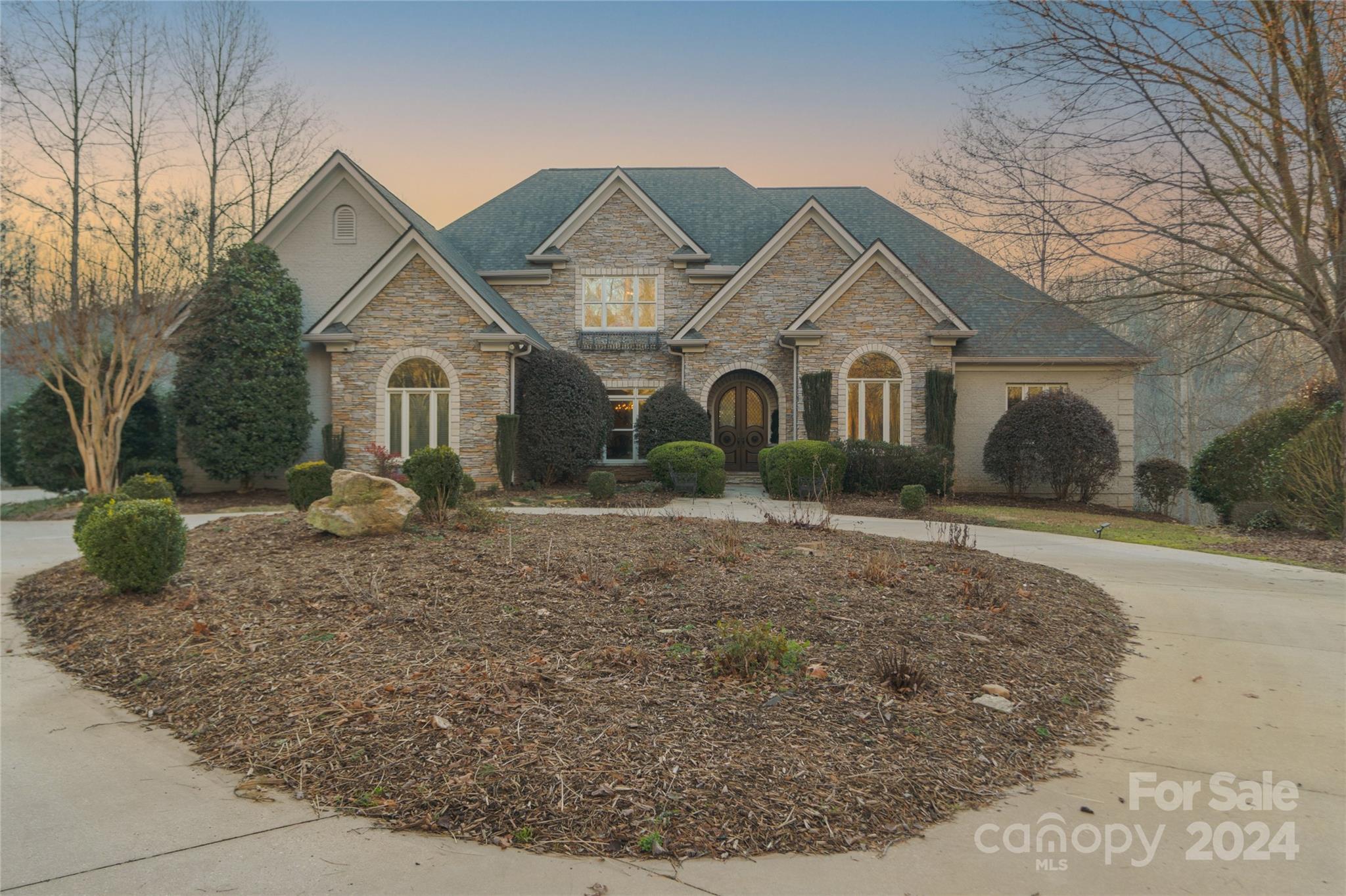 In the prestigious Cliffs Valley development near Greenville and Asheville, 605 Fernlawn Court, Travelers Rest, SC, embodies luxury over a serene 2.39-acre lot and 6,500 sq ft of sophistication. New Roof, New Skylights, New Gutters, 2 New HVAC units and Freshly Painted all within the last year.  Assumable VA mortgage at 2.25% for VA qualified buyer. Brazilian hardwoods greet you, leading to a versatile layout with a two-story great room, gas fireplace, and custom kitchen featuring granite and coffered ceilings. The master suite offers a private retreat with a fireplace and spa-like bath. Additional bedrooms boast en-suite bathrooms, and the lower level features a second kitchen, entertainment spaces, and ample storage with a four-bay garage. Exclusive amenities, including a golf course and wellness center, enhance this unparalleled living experience, minutes from urban and quaint street towns, affirming its unmatched value in luxury living.