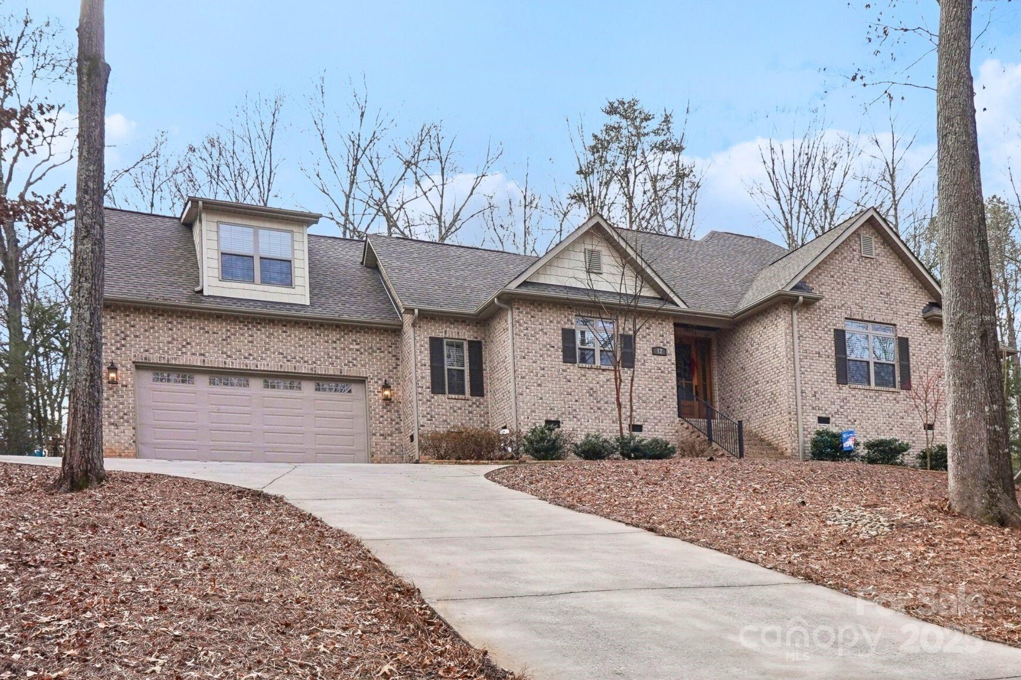 Custom-built all-brick ranch in River Hills, a private gated community on Lake Wylie! One of the newest-built homes in the entire community, this 4-bed, 3.5-bath gem was completed in 2019 and offers a blend of modern comfort and relaxed lake living. 

Extensive upgrades in the last two years include a custom hardscape patio with fire pit, outdoor kitchen with Traeger grill space, storage, and electricity, as well as a new fence and retaining wall. Inside, you’ll find fresh paint, custom living room built-ins with a wine fridge, and a stunning stone fireplace with mantel and hearth. The garage features epoxy flooring, custom shelving, and added electrical outlets. Additional improvements include a whole-home air filter and a beautiful waterfall window in the primary bath. Enjoy the open-concept living/dining area, screened porch, and lush wooded views. River Hills amenities include lake access, marina, clubhouse, dog park, playground, and more! Schedule your private tour today!