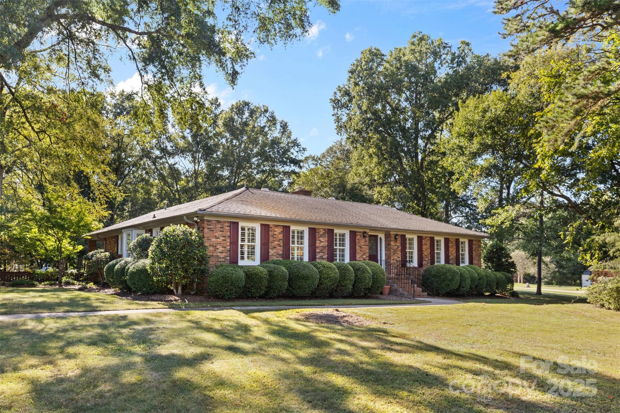 Charming 3-bedroom, 2-bathroom full-brick ranch home on a stunning 4.7-acre property! This home features a renovated kitchen with stainless steel appliances, a gas cooktop and granite countertops, a formal dining room, a formal living room and family room, as well as a beautiful sunroom surrounded by windows. The rest of the home includes two large secondary bedrooms with walk-in closets and a full bath, along with a primary bedroom with en-suite bathroom. Outside, you'll find an in-ground pool, covered patio, courtyard, as well as ample lawn space to enjoy! In addition to the main house, this property includes a studio apartment with a full bath and kitchenette, an oversized RV garage with lift and second-story walk-up storage, a small pool house, as well as two additional outbuildings that could be upfitted for a variety of uses! The 4.7 acres also features both wooded space and a large pond. Truly a unique property you will not want to miss!