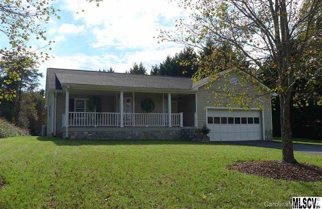 Quiet country setting for this spacious one-level home in Hildebran. An inviting rocking chair front porch welcomes you into the open great room with gas log fireplace and adjoining kitchen with bar seating, dining area, and exit to the rear deck. The split bedroom floor plan offers a private master suite with walk-in closet and full bath. On the opposite side of the house, you'll find two bedrooms sharing a hall bathroom.
