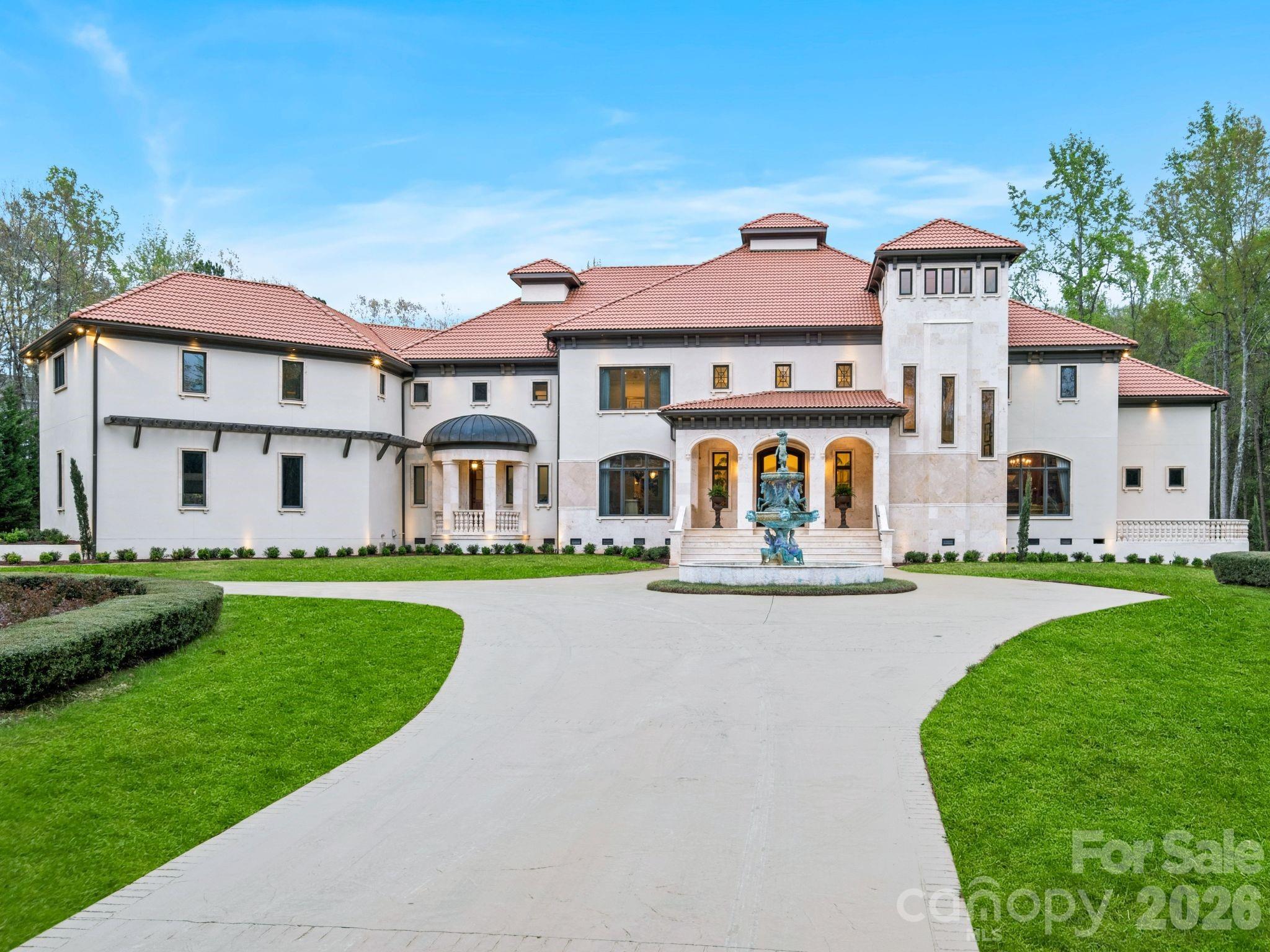 Welcome to this extraordinary five-acre estate nestled within the exclusive gated community of Evermay in South Charlotte. From the moment you arrive, the home makes a grand statement—elegant, and thoughtfully designed to impress at every turn. Inside, you’re greeted by stunning architectural details: sweeping arched ceilings, intricate ironwork railings, imported marble floors, and hidden balconies that add both charm and intrigue.

The main level is perfectly curated for both refined entertaining and everyday luxury, featuring sophisticated formal spaces, a custom bar, and a chef’s kitchen that seamlessly flows into a warm, inviting family room. The first-floor marble floors are heated, adding an extra layer of comfort and luxury throughout the space. Walls of windows and open sightlines draw you effortlessly outdoors to an expansive living area designed for unforgettable gatherings or peaceful relaxation.

Recent improvements elevate the home even further, including new white oak hardwood flooring in the primary suite, new lighting, traditional elegance, and a newly turfed courtyard—offering a fresh, low-maintenance outdoor space that is as beautiful as it is functional. 

Every inch of this property reflects craftsmanship, intention, and a sense of timeless beauty, offering not just a home, but a lifestyle defined by privacy, elegance, and effortless indoor-outdoor living. The Cabana/covered terrace area is extradentary as it offers an additional 1,450 sq.ft, an outdoor kitchen, fireplace, grilling station and full bath. This is truly a one of kind home that has been meticulously maintained and updated throughout the years.