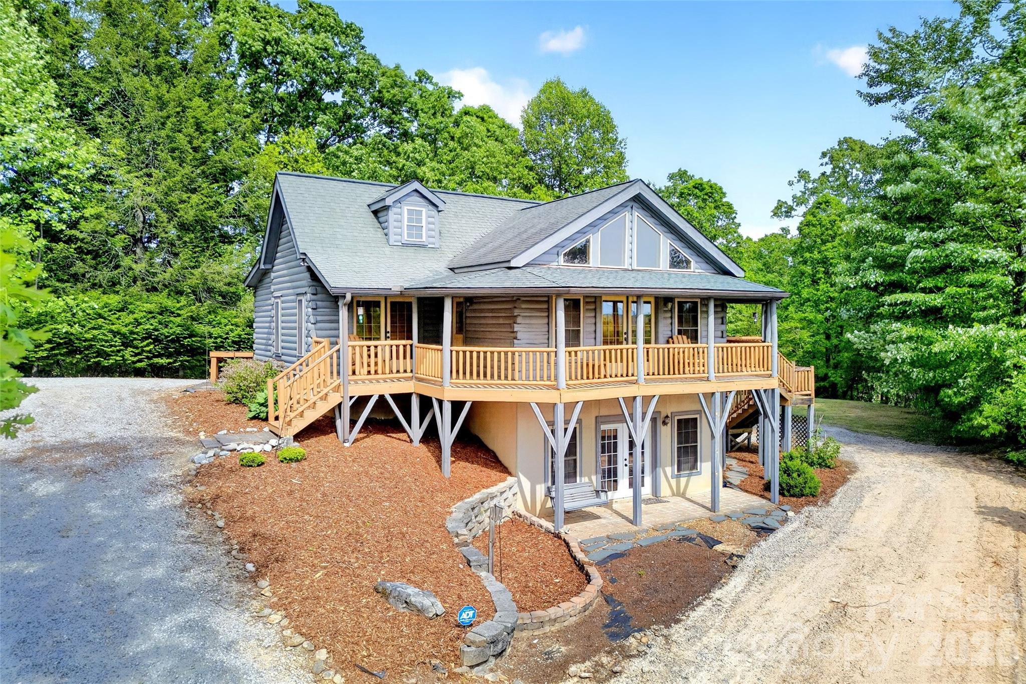 Welcome to this stunning log home nestled in the hills of Western North Carolina! Conveniently located just minutes from downtown Marion, Lake Tahoma, Lake James, and many public lands and National Forests, this beautifully maintained home offers the perfect balance of privacy and accessibility. Inside, you’ll find a spacious primary suite on the main level, a fully equipped basement apartment with kitchenette, and a sun-filled living room showcasing breathtaking mountain views. Enjoy the mountain breeze on covered porch! Whether you’re looking for a peaceful retreat or a place to entertain, this home truly has it all. Come experience the charm and beauty for yourself