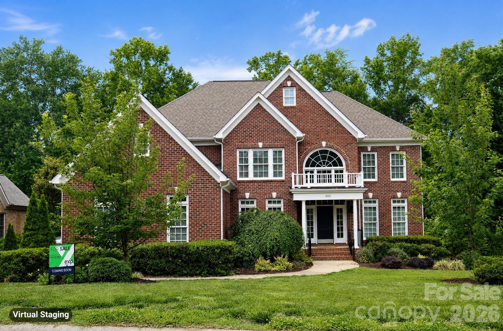 880 Hickory Stick Drive is a beautiful all-brick home featuring 5 bedrooms, 4 full bathrooms, and a gourmet kitchen like no other. This thoughtfully designed residence showcases timeless style, elegant upgrades, and exceptional indoor-outdoor living spaces.  Located on a quiet cul-de-sac street with quick access to I-77, shopping and dining.

Inside, rich wood floors extend throughout the entire home—both upstairs and down—creating warmth and continuity across the spacious layout. The main level includes a desirable guest bedroom and full bath, formal living room, dining room, inviting family room, and beautifully appointed gathering spaces filled with natural light. Upstairs, you’ll find four generously sized bedrooms along with a dedicated office space accented by beautiful French doors. The oversized primary closet and upgraded spa-inspired primary bath elevate the owner’s retreat, while upgraded lighting throughout the home adds sophistication far beyond standard builder finishes.

The gourmet kitchen is designed for both entertaining and everyday living.  Featuring custom cabinetry, professional-grade appliances, and expansive prep space. Anchored by a stunning 48-inch Thermador dual fuel range and paneled 48" built-in Sub-Zero refrigerator, the kitchen delivers both beauty and high-performance functionality for serious cooking enthusiasts. An oversized kitchen island offers abundant storage and includes a 36-inch built-in Thermador oven, microwave drawer, and warming drawer. The breakfast bar showcases a beautifully designed serving area with illuminated glass cabinetry, a Sub-Zero wine refrigerator, and two refrigerator drawers. The sink area is flanked by dual dishwashers, making cleanup effortless after gatherings large or small.

Outdoor living is truly a standout feature of this property. The huge covered back porch spans approximately 30x16 and overlooks the large, level backyard and fenced side yard. An additional oversized 20x20 natural stone patio provides even more space for outdoor dining and grilling. Beautiful recessed sliding doors from the kitchen and dining areas seamlessly connect the indoor living spaces to the expansive covered porch, creating effortless flow for entertaining and everyday enjoyment.

Additional highlights include double laundry hookups upstairs plus an optional laundry area on the main level, as well as a spacious 3-car side-load garage with exterior access to a workshop area and a 50 amp dedicated line that can be moved for EV use.  The home was recently inspected and is ready for the next chapter in life.