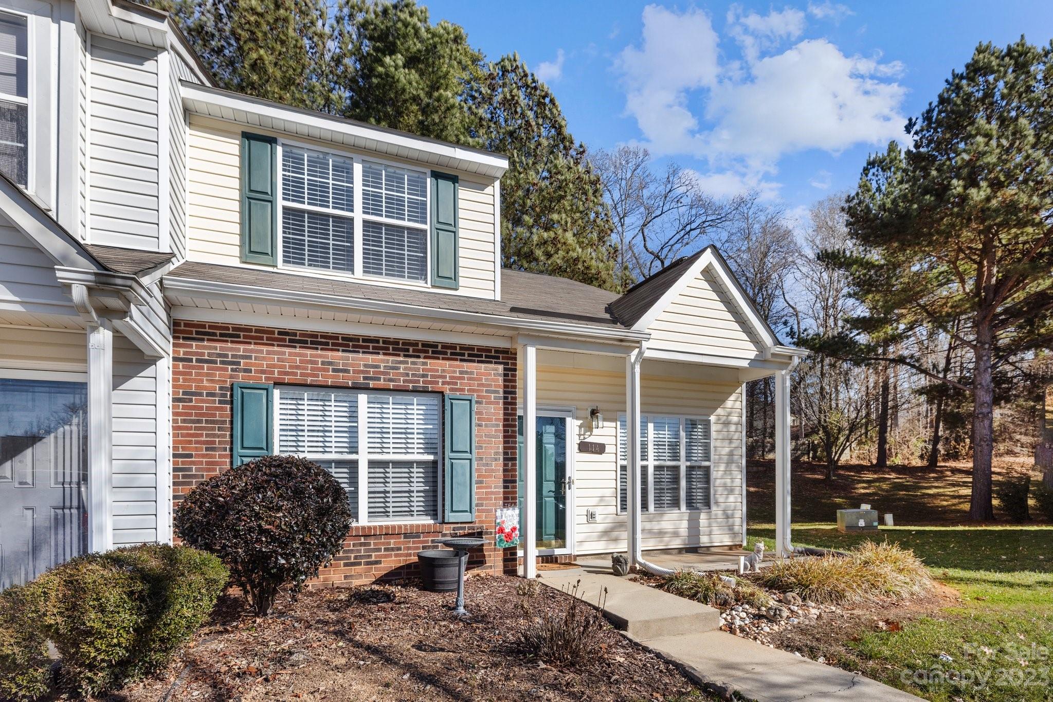 END UNIT with first floor primary bedroom.  Make this 2 bedroom, 2.5 bath home your own with lots of natural light, hardwood floors, smooth ceilings and fresh neutral paint.  Desirable Fort Mill location just minutes away from Fort Mill's top rated schools, charming vibrant downtown, local parks, and lots of dining /shopping options.  Commuting is a breeze with easy access to major highways.  Kitchen has painted cabinets, breakfast bar, ample lighting and newer stainless appliances.  Upstairs loft area could easily be enclosed to provide a private bedroom/office.  Enjoy the secluded, enclosed back courtyard creating the perfect retreat for greeting the day with coffee, unwinding at the end of the day or hosting BBQ's.