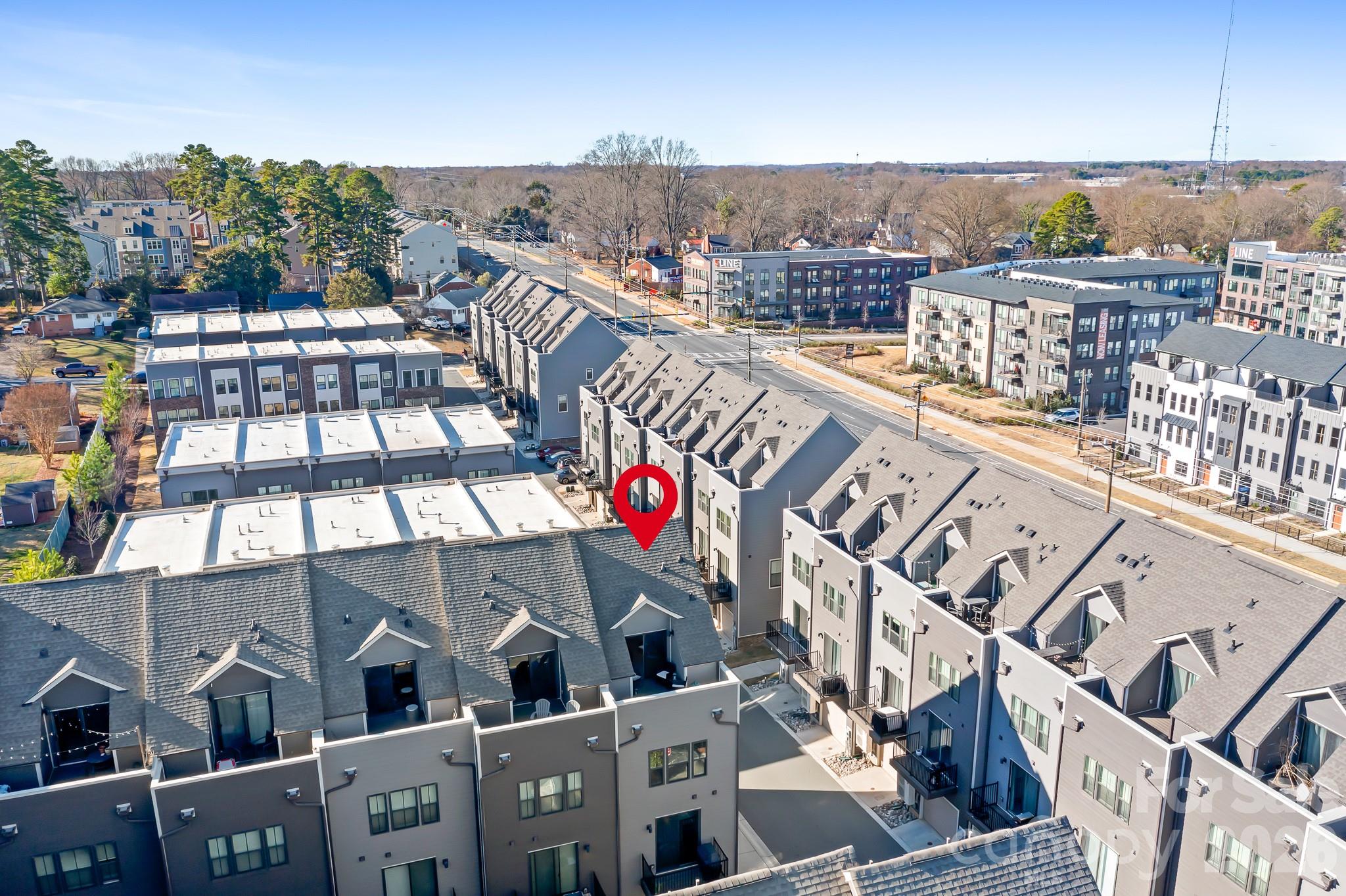 SELLERS WILL ENTERTAIN OFFERS BETWEEN $480,000 – $500,000 OR ABOVE. 1% RATE BUY-DOWN for the first year with preferred lender! Plus, refinance within 3 years with no origination fee. Move-in ready with all appliances included.

Welcome to this rare end-unit townhome offering the perfect blend of location, privacy, and flexibility—tucked away from the main road in the heart of LoSo.

Step inside to a welcoming first-floor entry featuring the ideal drop zone and a versatile space perfect for a home office, guest suite, or workout room—designed to adapt to your lifestyle.

Upstairs, enjoy a light-filled main living area that’s perfect for entertaining or unwinding, with easy access to the deck for cookouts and relaxed evenings. The upper level offers comfortable and private retreats, including a serene primary suite, two additional bedrooms, and a versatile fourth bedroom that can also function as a spacious loft, complete with its own oversized terrace—ideal for morning coffee, sunset views, or peaceful outdoor living.

All of this in an unbeatable location, just minutes from South End, Uptown, top dining, and entertainment—while still enjoying the privacy of a quiet setting and the flexibility today’s buyers crave.