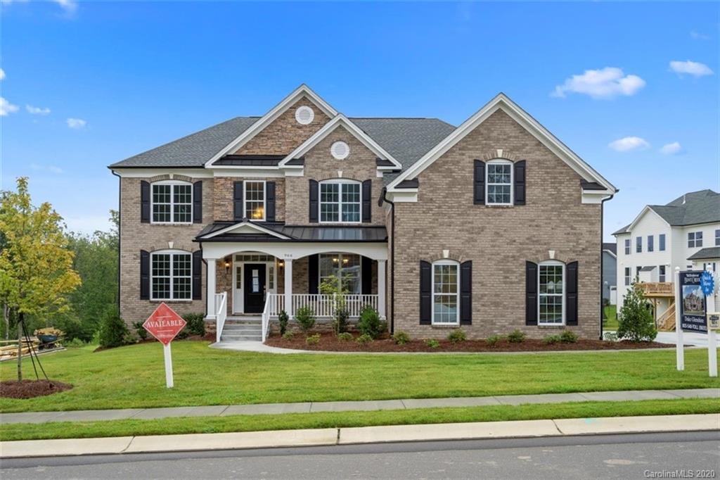 Welcome to this BRAND NEW home in Bent Creek, in Indian Land, SC! Special features include: 3 car garage, hardwood floors, two story foyer, decorative trim/molding throughout, formal dining room, office, spacious living room, and an open floor plan. The chef's kitchen features gourmet cabinets,large center island, quartz counter tops, tile back splash, upgraded light fixtures, 5 burner gas range, and breakfast nook. The laundry room off the garage offers tons of storage and a sink. The main floor has a bedroom with access to a full hall bathroom with granite counter tops and a tiled shower. Upstairs the huge primary bedroom has a seating area, vanity counter, two walk in closets, and a spa like ensuite with tiled shower and soaking tub, and two sink vanities with quartz counters. 3 bedrooms, one of which has a private bathroom, share access to a full hall bathroom and huge bonus room/loft for extra entertaining space. Enjoy time overlooking the private backyard on the back deck.