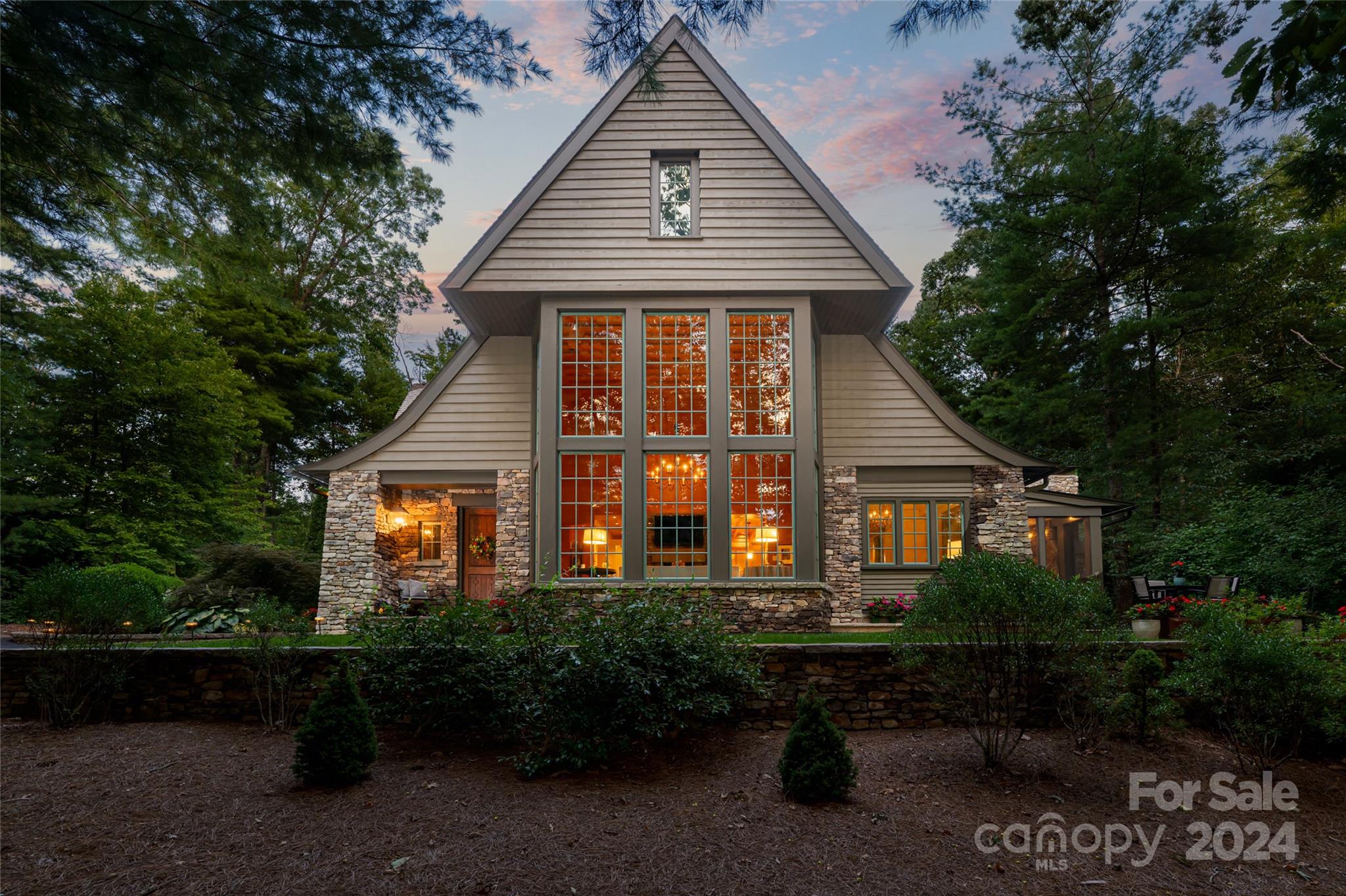 85 Chauncey Circle is a true triumph of exceptional design and craftsmanship. Seamlessly blending the best in natural materials and contemporary high-end finishes. Upon first impression, one is greeted by a stunning custom front door that reveals the foyer and open-concept floor plan. The expansive cypress flanked living room offers uninterrupted sightlines to almost all living areas on the main level, setting the tone for a light-filled ambiance radiating throughout. Warmth emanates from a see through, stacked stone fireplace that leads to the gourmet kitchen. Formal dining, breakfast room, the primary suite, and a screened porch with fireplace complete the main level. Upstairs features a family room for gathering, wet bar, four bedrooms and three and a half bathrooms. Natural landscaping creates a serene setting in the heart of South Asheville. This house has achieved NC Healthy Built Home certification.