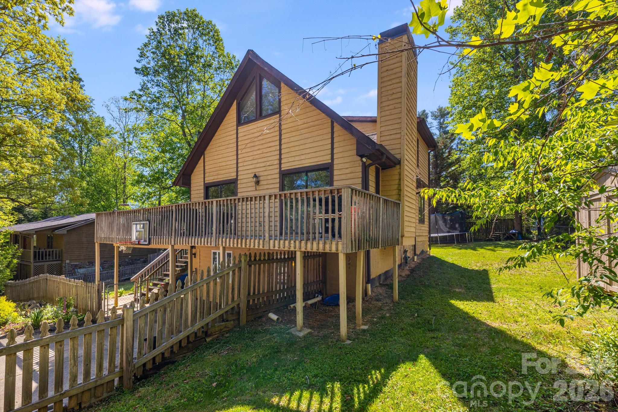 Welcome home to Fletcher! This inviting property is ideally located just minutes from shopping, dining, and the airport, making everyday living both easy and convenient.

The main level features a beautifully renovated kitchen with stainless steel appliances, a cozy gas log fireplace with a stunning stone surround, vaulted ceilings in the living room, and a spacious deck—perfect for grilling out or entertaining friends and family. Additionally, there is one bedroom and a centrally located full bathroom. Upstairs, you’ll find a generous primary suite complete with a full bath and walk-in closet. The lower level offers one additional bedroom and two versatile bonus rooms, providing endless possibilities for guests, a home office, or recreation space.

In addition to the updated kitchen, the furnace and hot water heater were both replaced in 2021. Outside, the large, fenced yard is ideal for pets, play, or simply enjoying the outdoors.

A comfortable home in a fantastic location—come see it for yourself!
