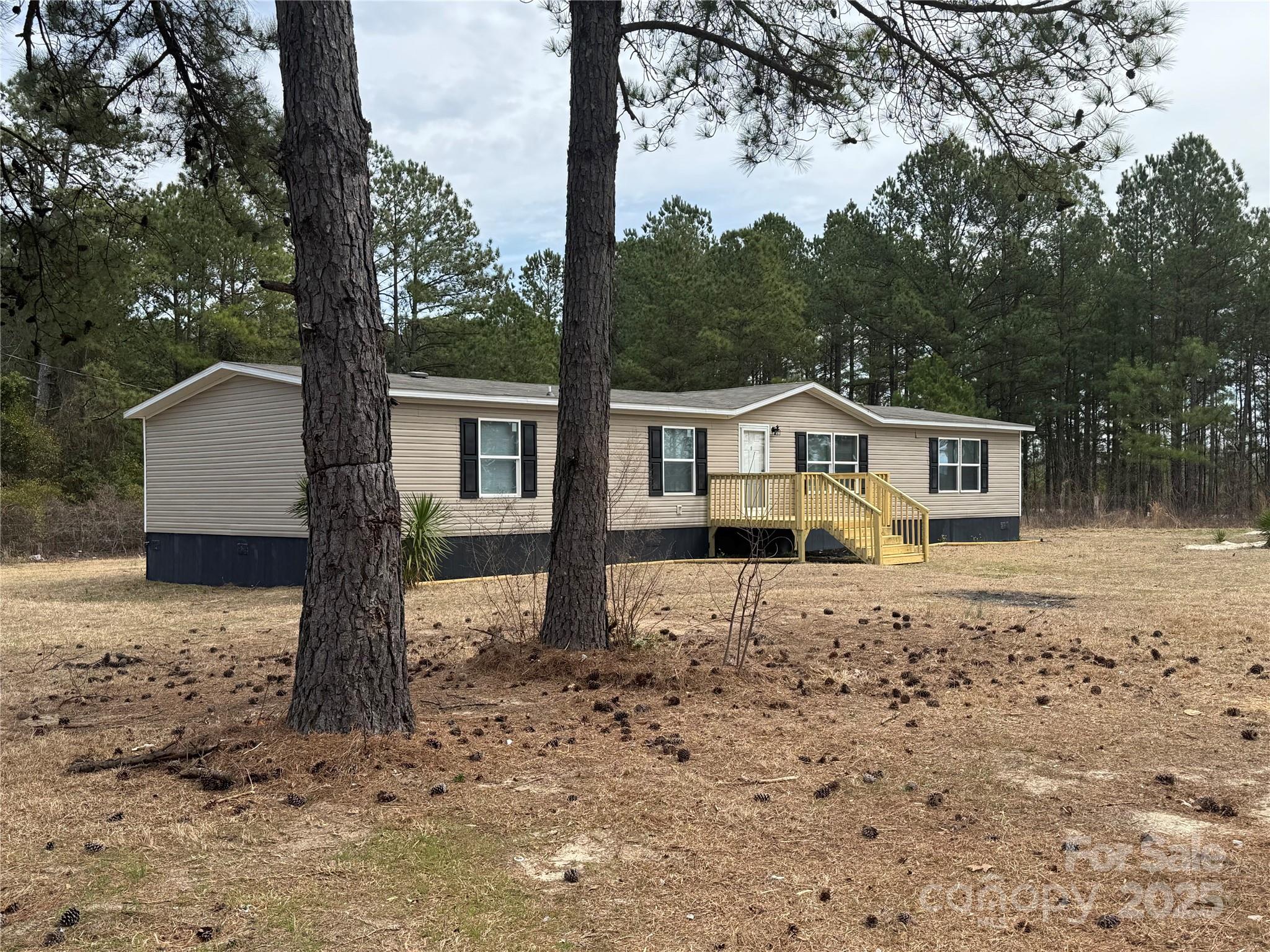 Nice! Large 2.36 Acre Corner Lot! Open Floor Plan with Approximately 1836 Sq Ft of Living Space! 2019 Year Model Manufactured Home. Living Room, Den, Island Kitchen with New Appliances. 4 Bedrooms, 2 Full Baths! Central Heat and Air,  Permanent Foundation, Public Water, Private Septic. Lot is Partially Wooded with Large Cleared Homesite Area.