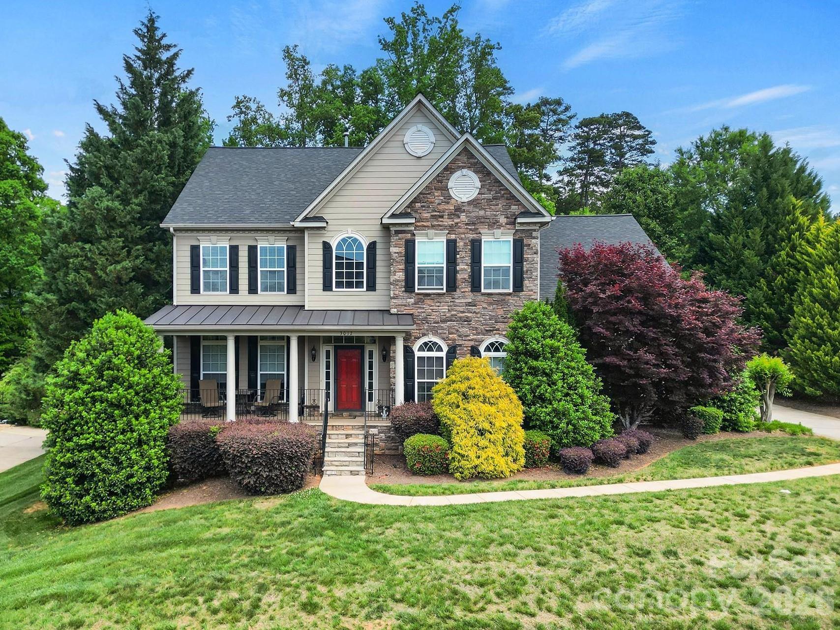 Welcome to this beautifully appointed two-story home in the desirable Lakepoint subdivision of Belmont, where thoughtful design and inviting spaces come together effortlessly in this lake community.

A charming covered front porch sets the tone, offering ample room for rocking chairs - perfect for enjoying quiet mornings or greeting guests with view of the lake. Step inside to a dramatic two-story foyer, flanked by a formal den on the left and an elegant dining room on the right, complete with a contemporary chandelier and classic wainscoting.

At the heart of the home, the stunning two-story great room impresses with floor-to-ceiling windows that flood the space with natural light. A gas log fireplace serves as a warm focal point, while a coffered two-tone ceiling adds architectural interest and sophistication. The open layout flows seamlessly into the kitchen, where granite countertops, a central island with seating, tile backsplash, and electric range create a functional and stylish hub for everyday living and entertaining.

A breakfast bar connects the kitchen to a bright sunroom/breakfast nook - an ideal spot for morning coffee or casual conversation while meals are prepared.

The main-level primary suite offers a serene retreat, featuring a tray ceiling with ceiling fan and a spa-inspired ensuite bath. Relax in the soaking tub, enjoy the convenience of dual vanities, and unwind in the spacious glass-enclosed shower. A generous walk-in closet completes the suite.

Upstairs, double doors lead to a versatile bonus room perfect for a home office, media room, or flex space. Three additional bedrooms and two full baths, including a jack-n-jill bath between two of the rooms, provide plenty of living space for family and guests, with select rooms offering peaceful views of the lake.

Outdoor living is just as impressive. Step onto the patio just off the great room, where a built-in gas grill makes entertaining easy. Spend summer days by the salt water pool with its striking rock water feature, or relax under the Tuscan-style pergola. A thoughtfully landscaped fire pit area invites cozy evenings under the stars.

Other notable features of this home include whole house water filtration system, roof 2019, 2 zone furnace 2025, hotwater heater 2026. 
All of this is just a short drive from Belmont’s charming downtown, offering lakefront dining, shopping, restaurants and a vibrant local scene.