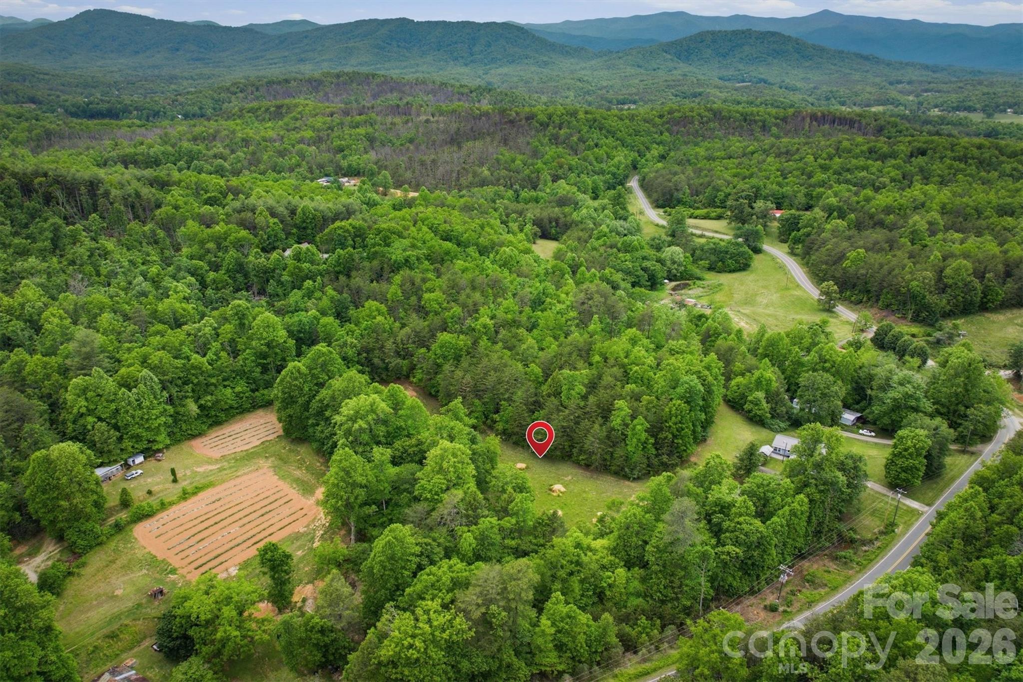 Looking for room to spread out and create the life you've always wanted? This 7.29-acre unrestricted property offers the perfect blend of privacy, freedom, and convenience. Nestled in a peaceful setting just 4 miles from the interstate, you'll enjoy a quiet country atmosphere while remaining within easy reach of Asheville, Black Mountain, Charlotte, and Hickory.
One of the property's standout features is a natural live spring flowing through the land- a rare and valuable asset for those interested in homesteading, gardening, livestock, or sustainable living. With gently rolling terrain, no restrictions, and no city taxes, the possibilities are wide open.
Whether you're planning to build your dream home, establish a mini-farm, or secure a long-term investment, this property offers an opportunity that's becoming increasingly difficult to find.