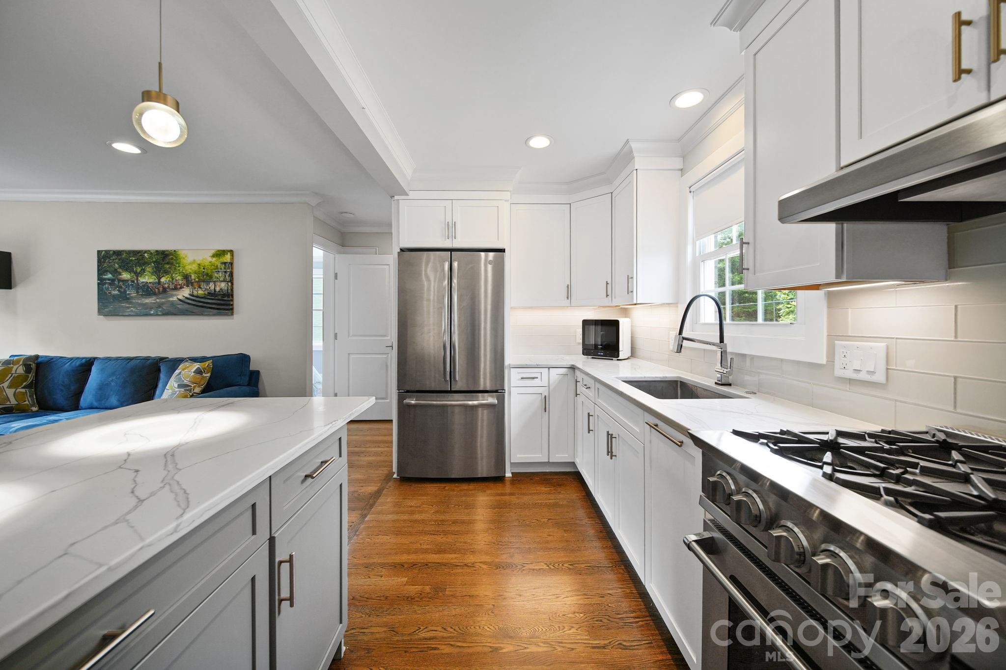 Gorgeous bright & sunny, completely updated modern top floor unit with the Little Sugar Creek Greenway access right at your back door! You'll love this open concept condo at Selwyn Village in Myers Park! Steps from all the restaurants and retail on Montford and at Park Road Shopping Center, makes this location prime for an easy lifestyle, convenient to everything. 
The renovation for this unit included removing walls to enlarge the kitchen & bath. Designer tiles and granite make this a fresh new looking space. Stainless steel refrigerator & commercial grade stainless steel gas stove plus a generous sized kitchen island are perfect for entertaining. Hardwood floors, & crown molding throughout. 
Ample parking for owners and guests. Quick access to SouthPark, Southend, and Uptown. Completely turn-key move in ready. Welcome home!