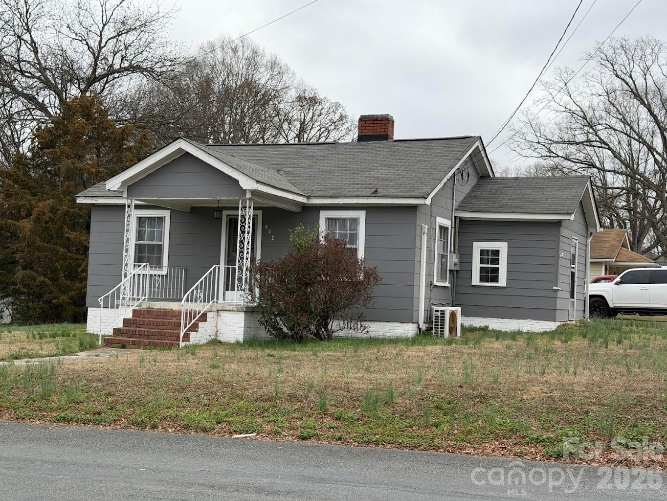 Located in the quaint town of Marshville, this home is close to everything. This home features two comfortable bedrooms and a full bathroom inside, providing a cozy living space. Step outside and you'll discover an impressive workshop equipped with electricity and two additional bathrooms, offering ample room for projects, hobbies, or extra storage needs.