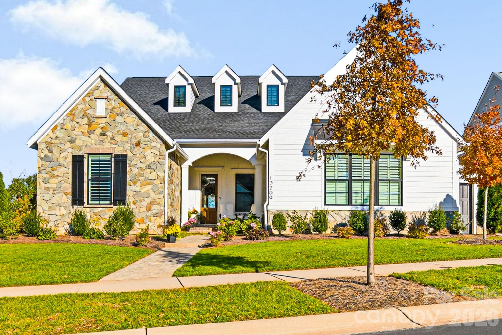 Better than new, this exceptional Oak Farm residence blends timeless elegance, superior craftsmanship, and upscale amenities with a thoughtfully designed open concept floor plan. Just two years young and truly move-in ready, this home offers effortless main level living at its finest.

The main level features a luxurious primary suite, two spacious secondary bedrooms, each with its own private vanity, plus a dedicated office and an elegant dining room. At the heart of the home, the chef’s kitchen impresses with an oversized island and high-end finishes, seamlessly flowing into the great room and overlooking the stunning outdoor living spaces.

Upstairs, a generous loft/bonus area, private en suite bedroom, and a secondary laundry hookup within a climate-controlled storage space provide ideal flexibility for guests or multi-generational living.
Step outside to your private backyard retreat, complete with a covered porch and fireplace for year-round enjoyment, plus a fully equipped outdoor kitchen and resort style saltwater pool with sun shelf, designed for both relaxing and entertaining.

Perfectly situated near shopping, dining, major interstates, Charlotte Douglas International Airport, and all that Uptown Charlotte has to offer, this home delivers luxury, convenience, and lifestyle in one remarkable package.