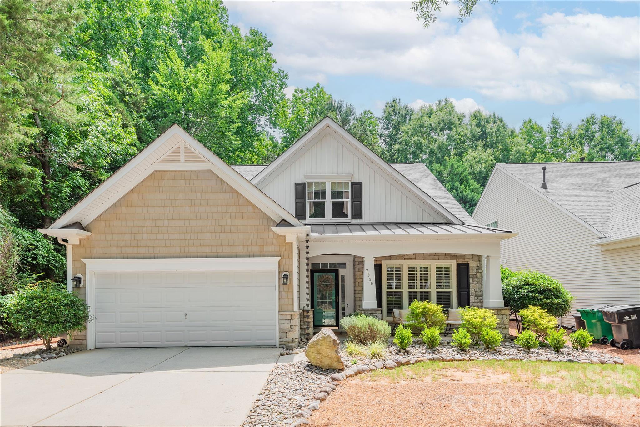 Low maintenance living meets a resort style retreat at 7330 Restoration Dr. Situated on one of the neighborhood’s most desirable lots, this home offers exceptional privacy with no home to the left and a wooded backdrop behind the property.

Inside, you’ll find hardwood floors and a versatile flex room just off the entry. The updated kitchen features white cabinetry, a tile backsplash, slate appliances, and an island that adds the perfect pop of color. The open layout flows seamlessly into the impressive two-story great room.

Step out to the heated and cooled four season sunroom and enjoy the private, low maintenance backyard with beautiful hardscaping and mature trees surrounding the space. The main level also includes a spacious primary suite, guest bedroom, and laundry room for convenient everyday living.

Upstairs, you’ll find a large loft area, an additional guest suite, and an oversized storage closet. Schedule your showing today and experience this exceptional home for yourself.