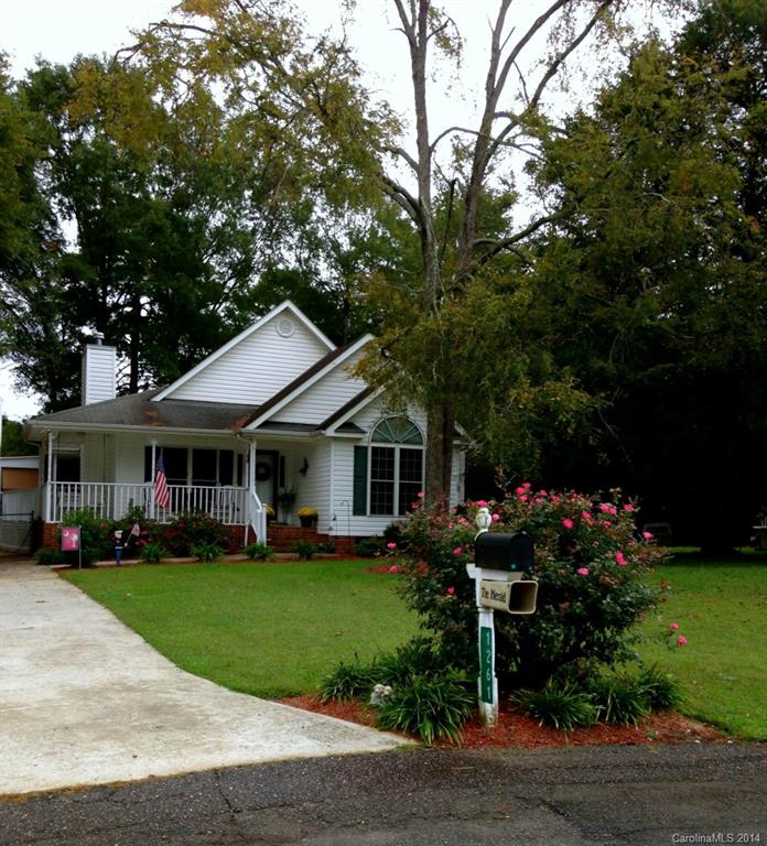 Adorable 3BR, 2Ba home with wrap around porch. This open split bedroom plan offers vaulted ceilings, fireplace, neutral colors, new flooring, fenced yard, covered side porch, no HOA and located on the perfect culdesac just minutes to shopping, dining and 77. Seller offering 1yr home warranty.