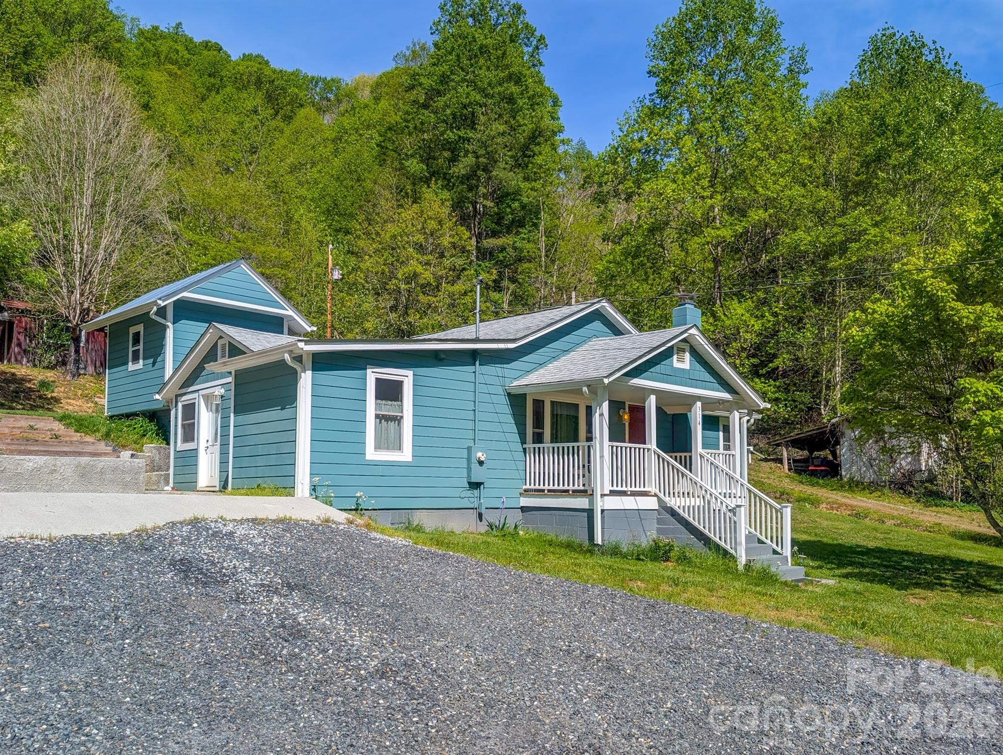 Charming, Move-In Ready, Fully Renovated Farmhouse on 1.65 Acres!
Step into timeless character with modern comfort in this beautifully renovated 1955 farmhouse. Nestled on 1.65 acres in the picturesque Pigeon Roost community, this 2-bedroom, 1.5-bath home offers the perfect blend of rural charm and updated convenience. The exterior of this home has been fully redone with new 2x6 framing, new insulation, new floor joists, Hardie board siding, and a new roof.

Inside, you’ll find a thoughtfully updated interior featuring a bright and inviting living space, an updated kitchen with stainless appliances, wine fridge, new HVAC system, updated electrical and plumbing, LVP flooring, and stylish finishes throughout. The home’s layout provides both functionality and comfort, ideal for full-time living or a peaceful retreat. Note - ceiling height is ~81-83". 

Outside, you'll find the large, storage building with power and the unique two-story canning room—perfect for food preservation, hobbies, workshop, additional storage as well as offering endless possibilities for homesteading or creative use. Enjoy the partially wooded acreage with room to garden, relax, or expand. This one-of-a-kind property combines classic farmhouse appeal with modern updates and practical extras—ready for you to call home. 

Schedule your showing today!
