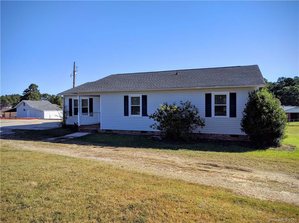 Well maintained home on 2+ Acre corner lot featuring 3 large BR's, 2 full baths, huge family room w/ gas log fireplace & hardwoods, super nice large eat-in kitchen with lots of storage plus all appliances stay, wood deck and wired workshop.  NO City Taxes & NO Subdivision.  New roof, windows and siding in 2011.  New HVAC (Heat Pump) in 2013.