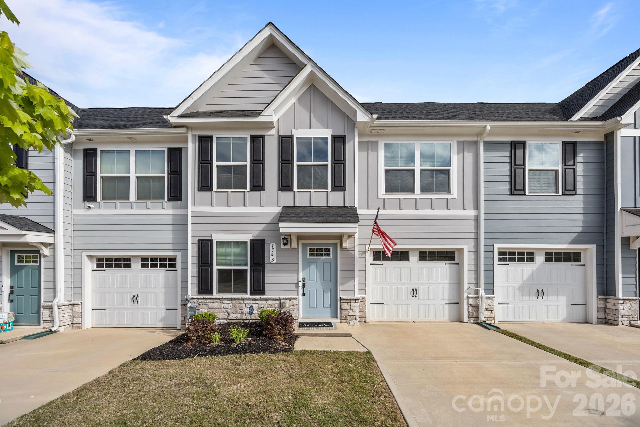Located in the heart of Troutman, this 3-bedroom, 2.5-bath townhouse is designed for easy, low-maintenance living with a functional layout and thoughtful upgrades throughout. LVP flooring runs across the main level, connecting the living space, dining area, and kitchen. The living room offers plenty of natural light, while a convenient half bath is positioned for guests. The kitchen features granite countertops, stainless steel appliances—including a gas range—ample cabinetry, and a center island with seating. A whole-house PURONICS reverse osmosis water filtration system (approx. $7,000 investment) adds an elevated level of water quality throughout the home. The primary suite is located on the main level and offers a spacious layout with a custom walk-in closet (approx. $2,500 upgrade) and an ensuite bath complete with dual vanities and an oversized shower. The laundry area is also on the main level, located just off the one-car garage for added convenience and everyday functionality. Outdoor space extends off the main level with an expanded Trex deck (installed one year ago, approx. $3,500), creating a comfortable area for dining or relaxing. Upstairs, two additional bedrooms each include walk-in closets. One bedroom offers access to walk-in attic storage, adding flexibility for organization. A full bathroom serves the second level. Additional features include a security system with exterior cameras and window and door sensors, along with several upgraded elements not commonly found in neighboring units.