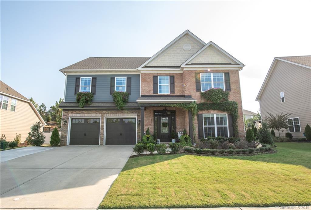 Like something out of a magazine, this stunning house will impress you with every turn, from the well manicured lawn to the 3rd story bonus room all the way down to the tranquil outdoor living space. Several upgrades have been included in this home such as the custom wainscoting through the entry way and in the 3rd floor bonus room/living space, ship-lap up the stairway, stone fireplace, pergola, extended driveway, fire-pit and much, much more! This home includes a formal dining room, sitting room, chef's kitchen, outdoor kitchen, Owner's suite and second Owner's suite on the second level, laundry room on second level and a third floor that includes a full bathroom, bedroom and living space. This house truly has it all! Community includes pool, clubhouse, fitness center, playgrounds, walking trail, tennis courts, ball fields and a pond.