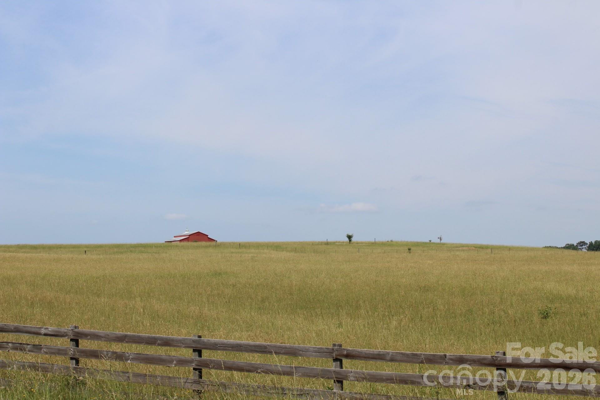 "Raintree Farms" - a beautiful and scenic development about 15 minutes from hustling & bustling towns like Chesnee, Boiling Springs, Landrum, and Tryon - situated about a mile from the SC / NC state line, off of Chesnee HWY and very close to HWY 11.  Raintree Farm was a 64 acre cattle farm with 2 large red barns and has been recently subdivided into 2 - 6 acre lots to create manageable "Farmettes" for people who want to live outside of the city, but not be too far away to "run to the store".  The lots will allow you to have livestock (horses, goats, chickens) or grow an amazing garden, without any HOA dues or restrictions.  The only restriction that will be implemented is "no mobile homes".  Many of the lots will have views of the barns or mountains.  As you stand on one of the lots, you feel the warm breeze in your hair and all you hear are the birds & crickets!  As municipalities continue to implement more and more restrictions, Lots like these are harder and harder to find.  Bring your vision & come claim your Piece of America - Amber waves of Grain - Peaceful Country Living -!   Buried High Speed Internet Available.  REMC Power Available.  Call With Questions!!