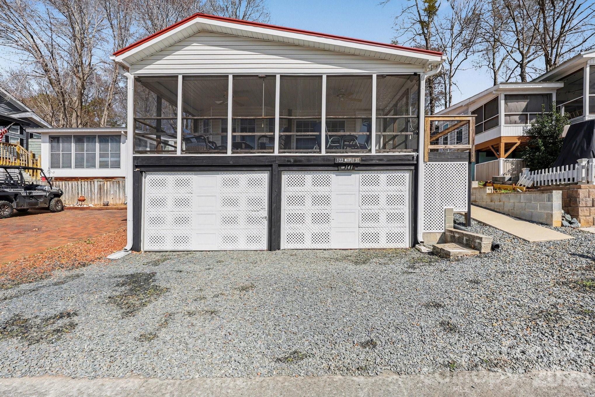 Enjoy Lake Views from This Charming Park Model Home in Badin Shores Resort! Take in the beautiful lake view from the comfort of your covered and screened-in porch at this 3-bedroom, 1.5-bath park model home with a spacious room addition. Located in the gated community of Badin Shores Resort, this home offers a smart layout with bedrooms on each end, creating a bright, open-concept space for the kitchen, dining, and living areas. Features include fresh paint, updated flooring in the park model, a washer/dryer, dishwasher, concrete walkway from the parking area, and storage space under the deck. All furniture and décor currently in the home will remain, making it move-in ready or the perfect weekend retreat. Resort amenities include a swimming pool, sandy beach area, waterfront boardwalk, restaurant, clubhouse, playground, basketball courts, putt putt, boat ramp, fishing pier and more—perfect for full-time living or relaxing getaways.