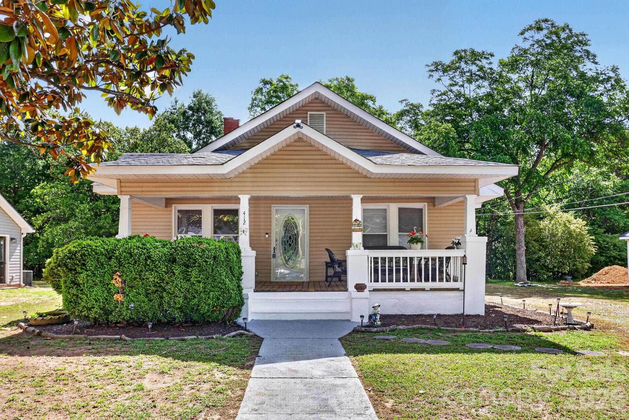 Located on a quiet street, yet convenient to everything, this house has been totally redone with windows, kitchen, bathrooms, flooring. and ceilings.