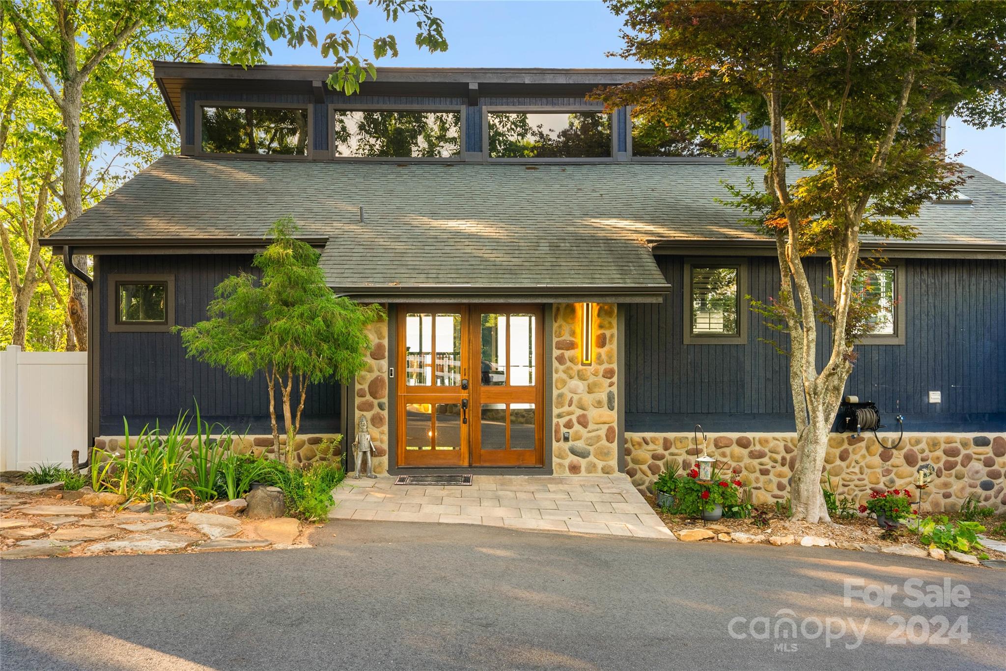 This mountain retreat offers exquisite mountain views! Fully renovated home with a main floor master suite, also includes a very private office. The master bath has been remodeled with a freestanding tub, gorgeous shower, walk-in closet with skylight and custom shelving. Views are everywhere you turn, with two decks with four sliders that allow lots of natural light in! The kitchen has a breakfast bar, quartz countertops, pebble backsplash, and all appliances remain. Downstairs, tons of flexible living area, two additional bedrooms, and bathroom with a zero entry tile shower. With 1.4 acres, fenced and gated at the driveway, you will feel at absolute peace at your mountain top retreat. Other amazing features include: new Anderson doors and windows, new wood Dutch front door, multi-tier water fountain remains, two TVs/Sonos sound bar in living room convey, ring cameras, and septic tank replaced in October of 2022.
