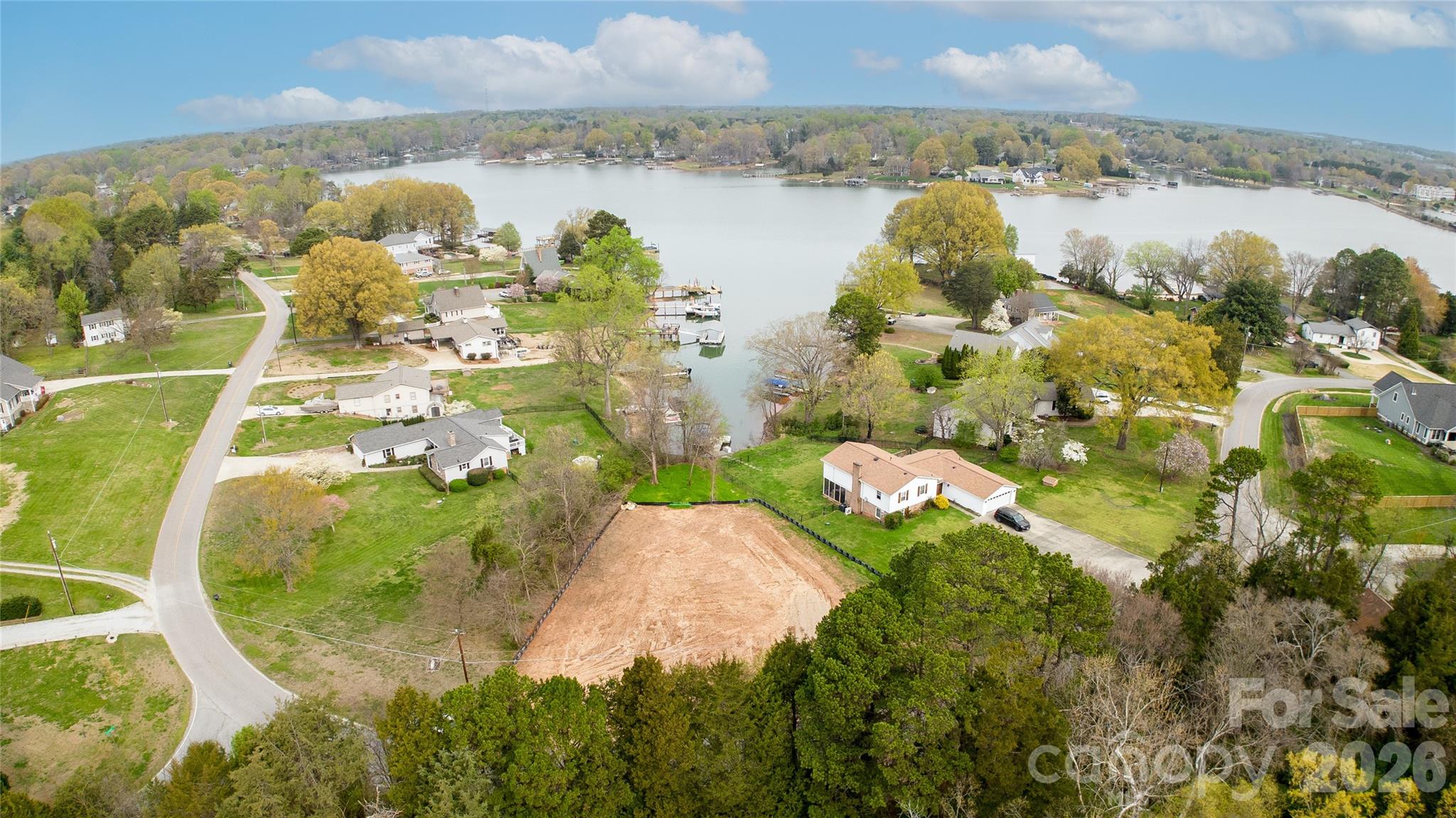 Rare opportunity to build your dream home on a beautiful lakefront lot on Lake Norman. Tucked away in a quiet, established neighborhood, this property offers the perfect blend of privacy and natural beauty. Adjacent to an unbuildable lot, you’ll enjoy an added sense of seclusion, surrounded by mature trees and the beauty of Lake Norman.

This lot is ready for your vision as it has been fully cleared, graded, and permitted for a 4-bedroom septic system —saving you time and effort as you plan your custom build. Enjoy private access to the shoreline, perfect for launching kayaks, relaxing by the lake, or enjoying the breath-taking views. With public boat ramps, docks, storage, and boat slips all just minutes away, you’ll have effortless access to everything you need to make the most of lake life.

Whether you’re looking to create a full-time residence or a weekend retreat, this property offers an exceptional setting to experience the very best of Lake Norman living.