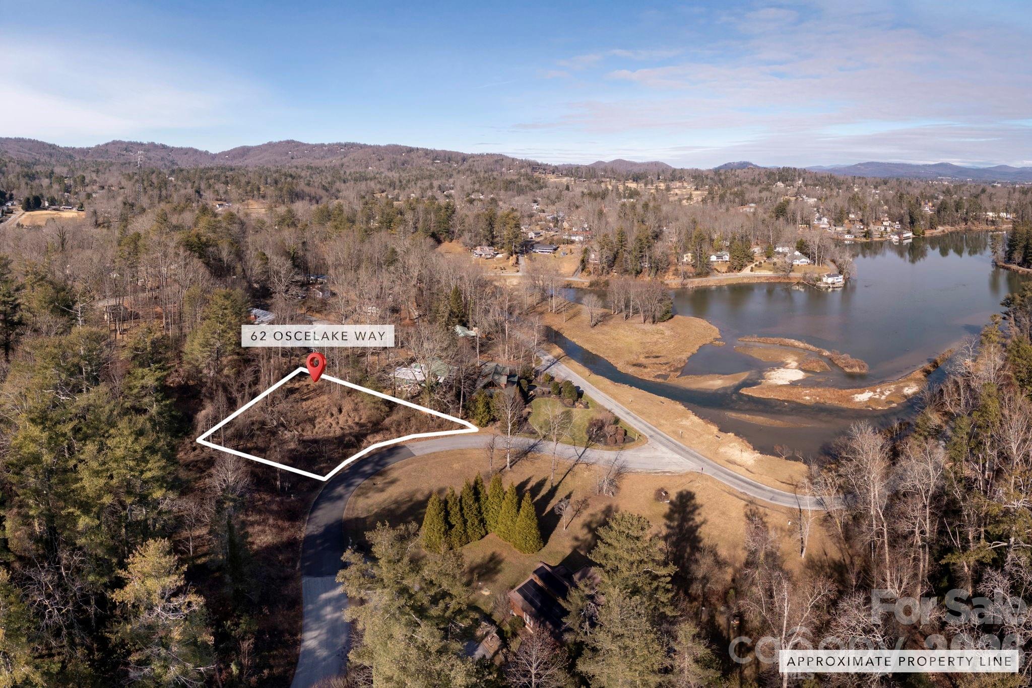 Welcome to Lake Osceola! You are literally minutes to Downtown Hendersonville but feel like you are a million miles away. Enjoy your morning stroll along the lake. Take a minute to relax and feed the ducks. .32AC Lot affords stunning views of the Lake. Motorized boats are not permitted on the Lake. Kayak for example is with yearly dues.  1400SF minimum to build. Off Frame Modulars are allowed with design approval from developer. Topography of lot is gentle. City water available.