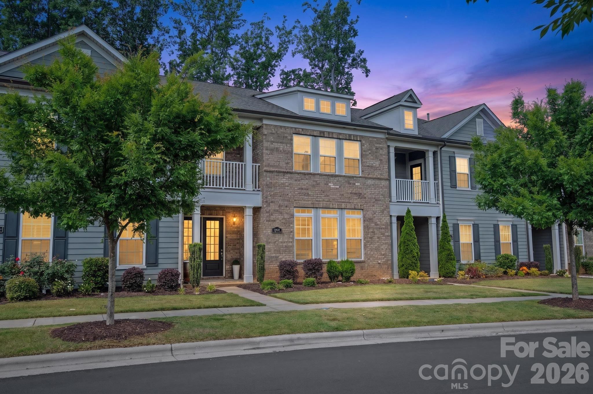 Luxury townhome living in the highly sought-after Providence Village, just steps from the vibrant shops and dining of Waverly. Built by John Wieland Homes, this beautiful 3-bedroom, 3.5-bath residence offers nearly 2,500 square feet of thoughtfully curated living space, and an easy walk to one of South Charlotte’s premier locations, Waverly.

Perfectly positioned for privacy, the home backs to a natural buffer for added seclusion, offering no rear neighbors and a peaceful, private backdrop. A true standout, this home lives like an end-unit residence with abundant natural light streaming through expansive windows and glass doors, enhancing its open, airy feel. The main level showcases an inviting open-concept layout featuring a chef’s kitchen with stacked cabinetry, quartz countertops, stainless steel appliances, gas cooktop with designer range hood, a large center island, elegant backsplash, walk-in pantry, and included refrigerator. The kitchen flows seamlessly into the dining and great room, where coffered ceilings, custom lighting, built-ins, and a cozy gas fireplace.

Upstairs, all three spacious bedrooms feature private en-suite baths and walk-in closets. The primary suite is a true retreat with dual walk-in closets (including a dressing closet), a sitting area and study/flex space, and a spa-inspired bath with an oversized frameless glass shower, dual vanities, designer tile, and upscale lighting. A private covered balcony adds an elevated touch of relaxation and charm.

Additional highlights include engineered hardwood flooring throughout the main living areas, a two-car garage, turned staircase, upper-level laundry with sink, lush carpeting, and storage. Enjoy the ease of low-maintenance living with HOA-covered lawn care, exterior maintenance, trash, cable, and internet. Community amenities include sidewalks, a dog park, garden space, and alley-load garage access.

Located in an award-winning school district and just minutes to I-485, this home offers the perfect blend of luxury, lifestyle, and location. Walk to Waverly, dine, shop, and enjoy everything this exceptional community has to offer—an easy walk from your door. A rare opportunity in one of South Charlotte’s most desirable townhome communities.