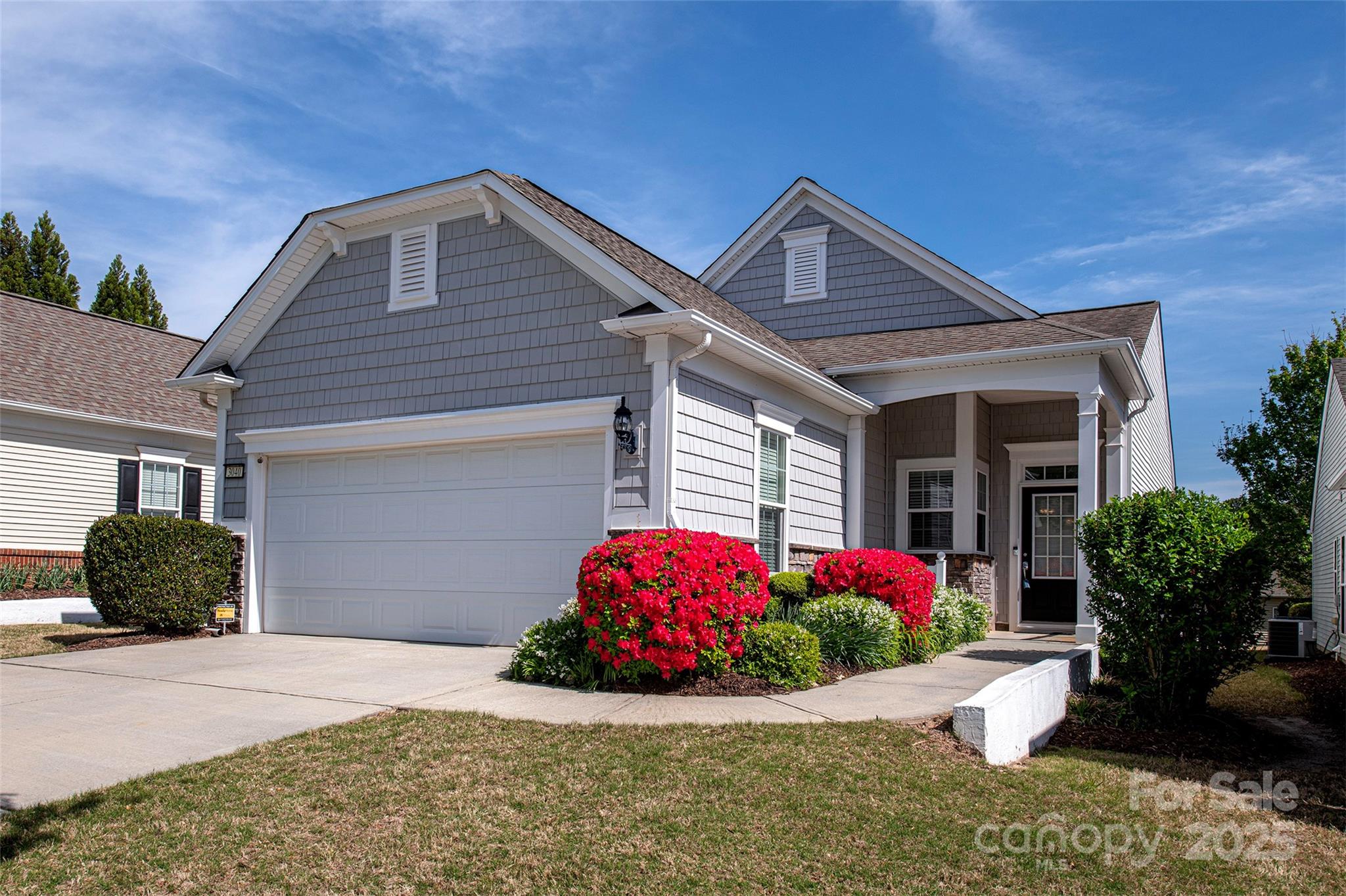 Beautiful stone & vinyl exterior-move in ready! This freshly painted & professionally cleaned home features a welcoming Foyer that opens into a spacious OPEN FLOOR PLAN featuring a LR & DR overlooking the Sunroom. Hardwood Floors flow throughout the main living areas. Sliding Doors lead to the Patio, perfect for outdoor relaxation. The Kitchen includes an Island, Pantry & opens to a sunny Breakfast Rm w/easy access to the Laundry Rm. A Guest BDRM-ideal for visitors or a home Office is tucked away in its own private hallway w/full BATH nearby. The Owners Suite is located at the rear of the home and features a large walk in closet and private access to a spacious BATH. New Trane A/C unit was installed in Mar 2025. Sun City at Carolina Lakes, a 55+ community offering exceptional amenities, incl swimming pool, tennis & pickleball, hiking trails, softball, etc. There is an HOA Capital Contribution Fee/New Buyer Fee of 1/3 of 1% of Total Sales Price that will be paid by the Buyer at Closing.