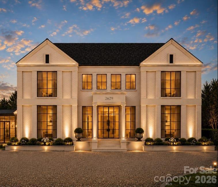 Crafted by renowned luxury builder David Simonini Signature Homes, this exceptional custom residence blends timeless architecture, thoughtful design, and uncompromising craftsmanship on a rare, over half-acre homesite in one of Charlotte’s most sought-after neighborhoods. Located in the heart of Lansdowne, this home offers an extraordinary combination of privacy, convenience, and luxury living just minutes from SouthPark’s premier shopping, dining, and entertainment, top private schools including Providence Day, and only 20 minutes to Uptown Charlotte.

Designed for both everyday living and elegant entertaining, the home showcases over 5,300 square feet of meticulously curated living space highlighted by luxury finishes, extensive custom millwork, designer lighting, and exceptional built-ins throughout. The main level features a stunning primary suite retreat, a chef-inspired kitchen with oversized island and walk-in pantry, scullery and prep area, formal dining room, private library, expansive great room, and seamless indoor-outdoor living spaces.

A private elevator provides effortless access to both levels, while the upper floor offers four spacious secondary bedrooms, each thoughtfully positioned for privacy, along with a large recreation room ideal for media, gaming, or gathering with family and friends.

The oversized three-car garage, dedicated fitness room, abundant storage, and thoughtfully designed floorplan deliver a level of functionality rarely found in luxury homes. Every detail reflects the quality and attention to detail that have made David Simonini Signature Homes one of Charlotte's most respected builders.

Set on a beautiful homesite of more than half an acre, this property offers the opportunity to enjoy luxury living in an established neighborhood known for its mature trees, larger lots, and unmatched location. A rare offering that combines custom craftsmanship, modern convenience, and one of Charlotte's most desirable addresses.