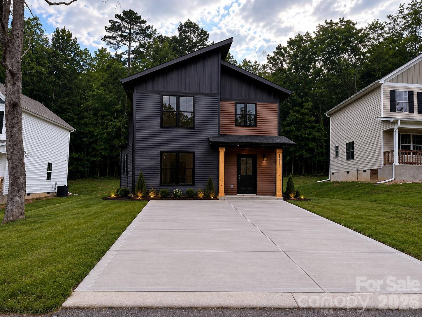 Experience lakeside living in this striking modern new construction home, perfectly positioned on a lakeview lot and designed to stand out with its bold black and cedar exterior. Offering approximately **1,400 square feet**, this 3-bedroom, 2.5-bath home blends contemporary style with everyday functionality.

Inside, you'll find soaring ceilings and an open-concept layout centered around a stunning fireplace, creating a warm and inviting space for entertaining or relaxing. The custom kitchen features premium cabinetry, granite countertops throughout, and a spacious layout that flows seamlessly into the dining and living areas. The private primary suite offers a peaceful retreat with a beautifully appointed bath, while two additional bedrooms and a convenient half bath provide plenty of room for family and guests.

Outside, a large concrete driveway adds convenience and curb appeal, while the lakeview setting offers the perfect backdrop for morning coffee or evening sunsets. With modern architecture, upscale finishes, and one of the most unique designs in the area, this home delivers the perfect combination of luxury, comfort, and scenic living.