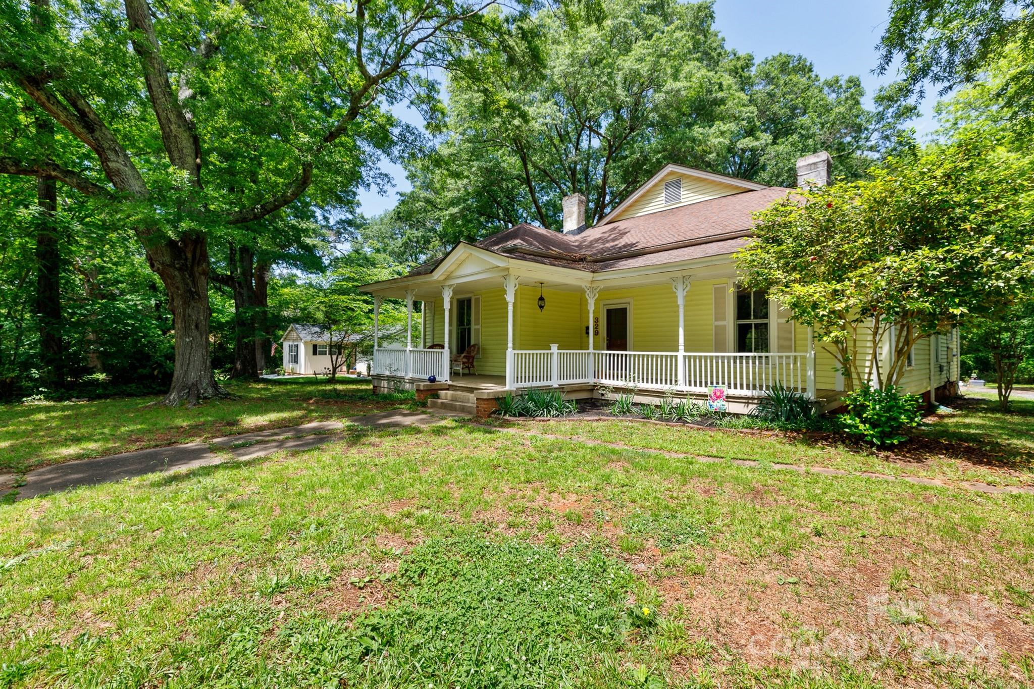 Step into the past & embrace a piece of history with this charming historic home nestled in the heart of York. This home exudes the southern charm with a spacious front porch & sprawling deck. The main floor welcomes you with a large living room, formal dining room & spacious kitchen with a cozy breakfast nook. 3 downstairs bedrooms, including a luxurious primary suite with new carpet, a vast walk-in closet & updated bathroom. Original hardwood floors grace one of the bedrooms, adding a touch of character. Ascend upstairs to discover 2 additional bedrooms & a bonus room, perfect for an office, playroom, or whatever your imagination desires. Outside you'll find a sturdy metal 2-car carport with attached storage. With this 0.52 ac lot of flat, expansive yard space, the possibilities are endless. Whether you move right in or are eager to infuse your personal style, this home offers both charm & potential at an unbeatable value. Similar updated properties command prices upwards of $500K.
